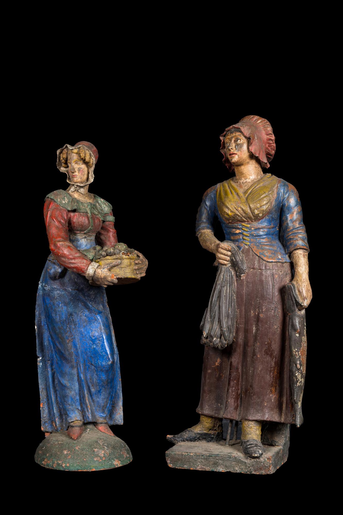 A pair of large polychrome terracotta figures of a fish- and fruit seller, 19th C. (1 of 5)