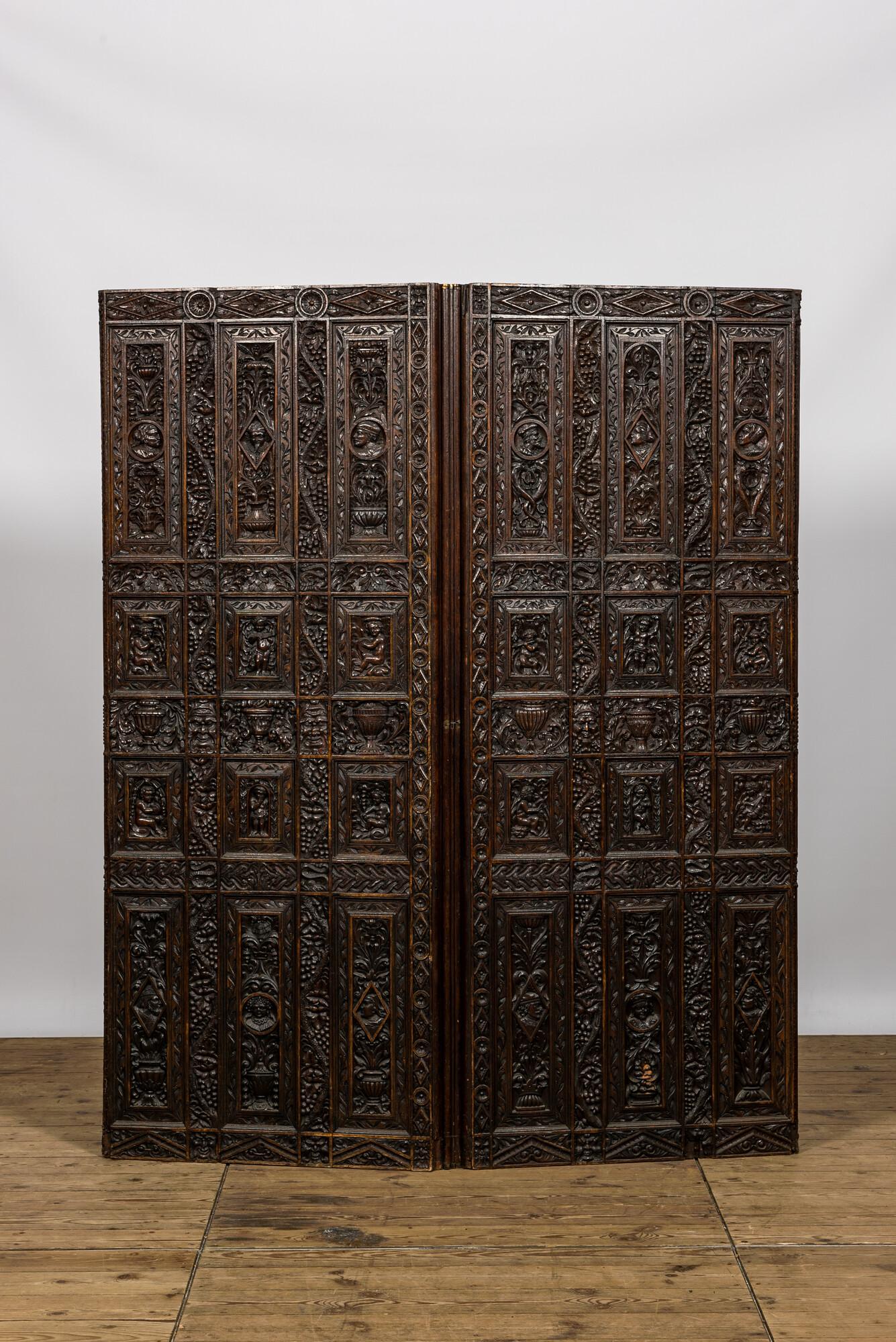 A richly sculpted two-panel French oak room divider with Japonism embroidery, France, 19th C. (1 of 6)