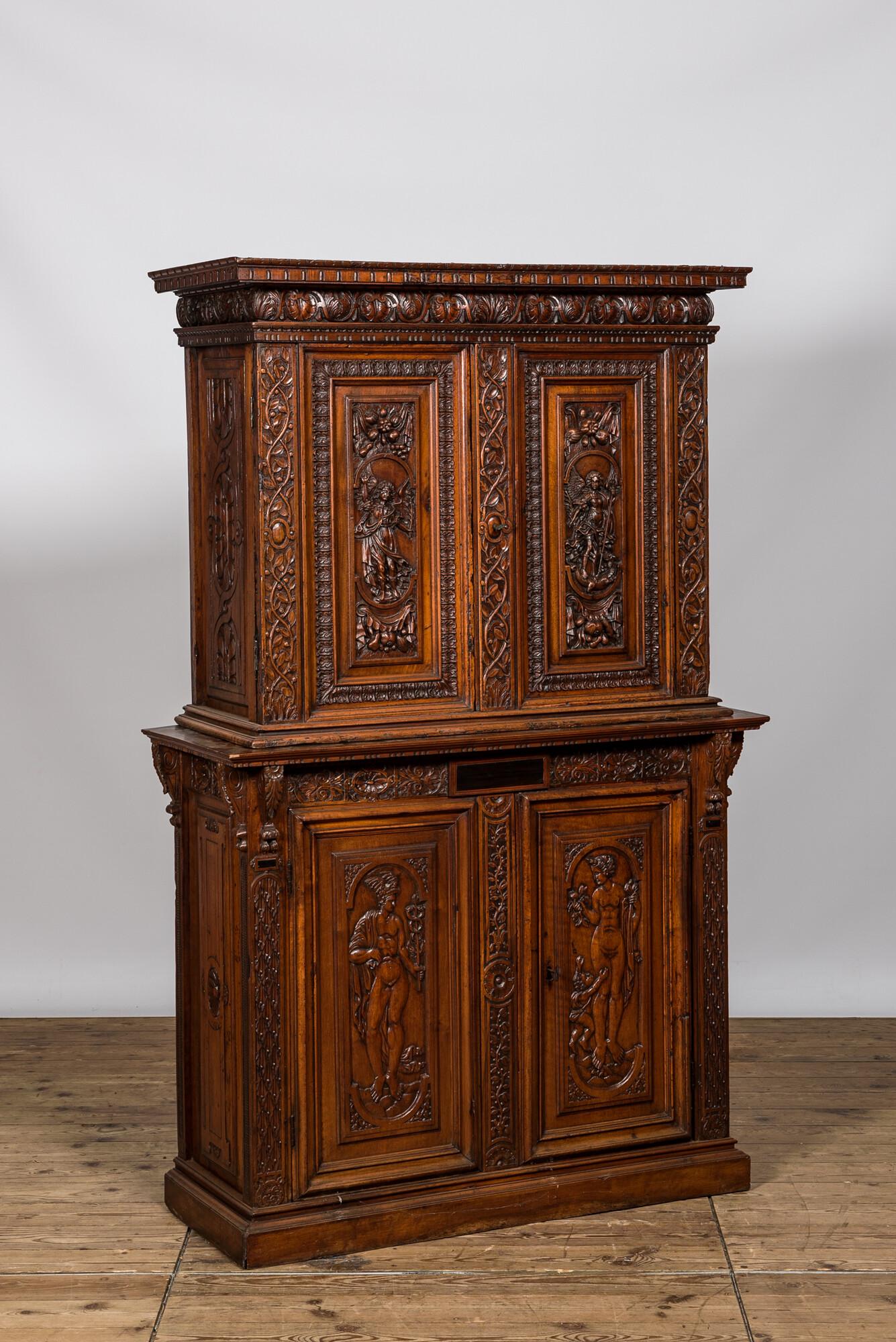 A richly carved walnut deux-corps cabinet with Hermes and Aphrodite, 19th C. (1 of 3)