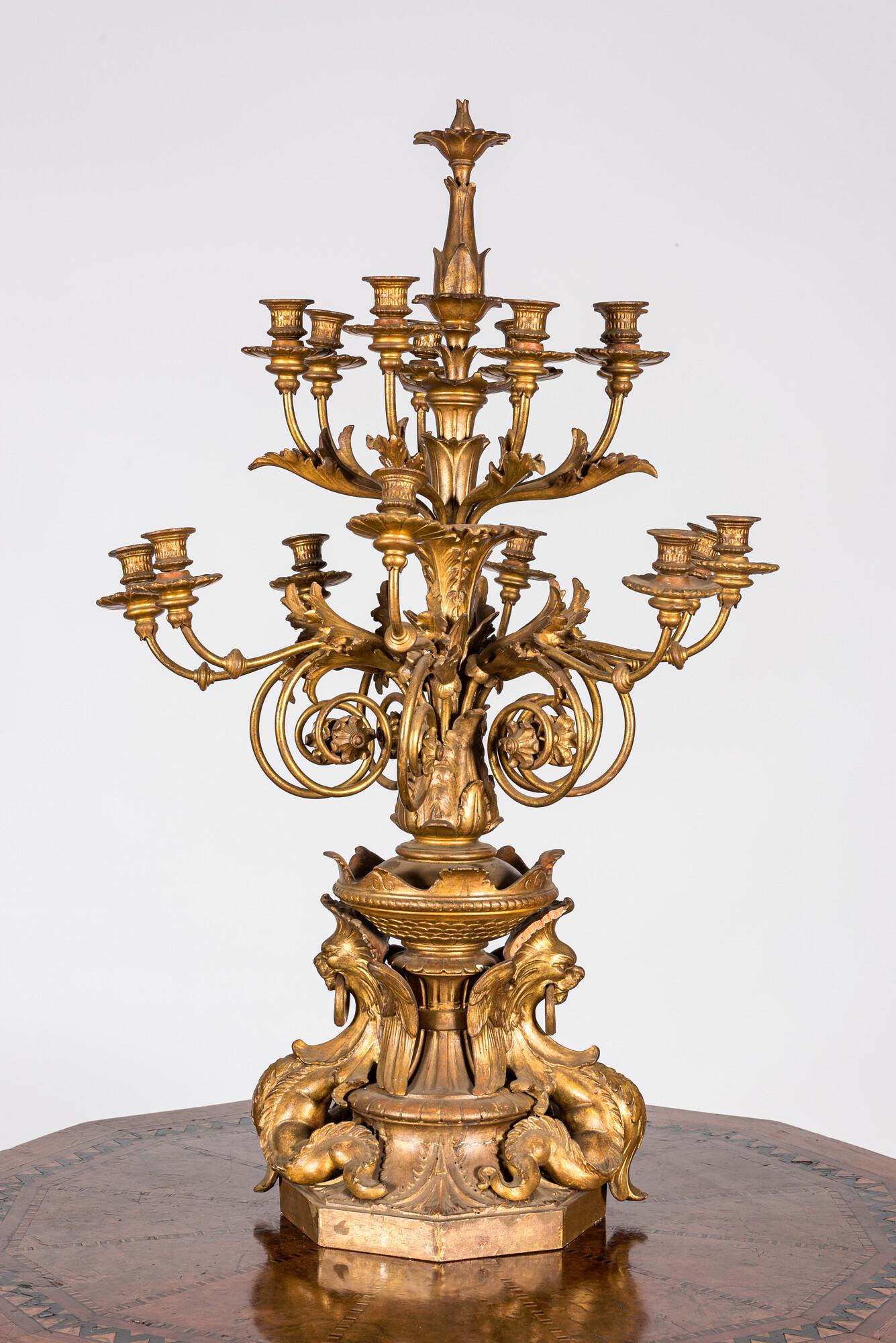 An impressive gilt wooden candlestick with gilt bronze sockets, 19/20th C. (1 of 2)