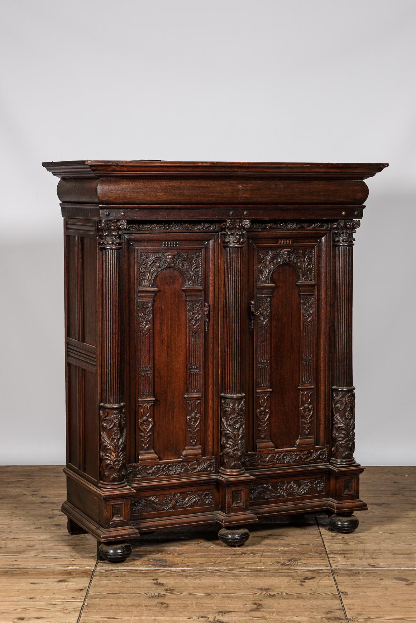 A Dutch oak two-door 'keeftkast' cupboard, 17th C. with later elements (1 of 3)