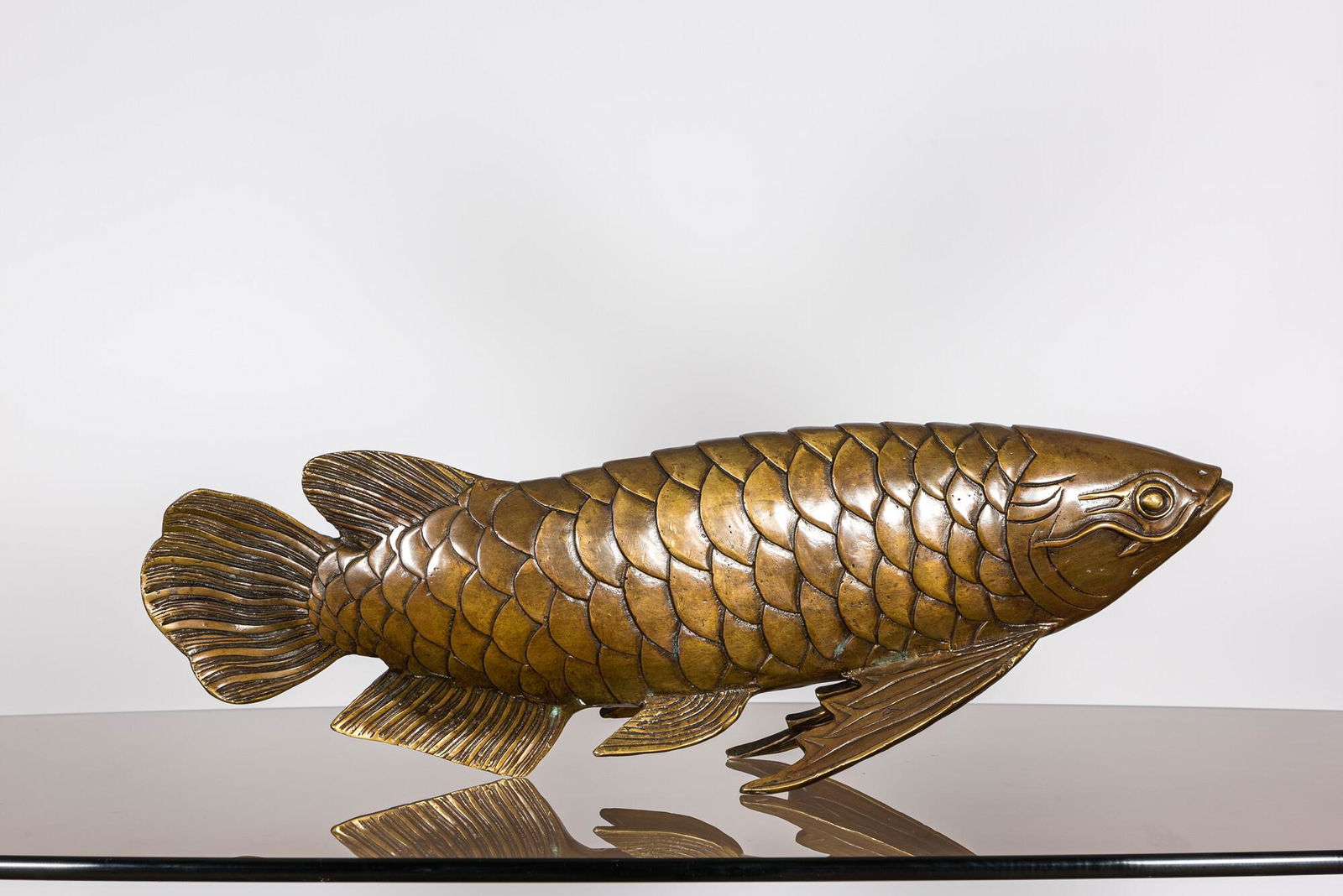 A Japanese bronze patinated koi sculpture, 19/20th C. (1 of 2)