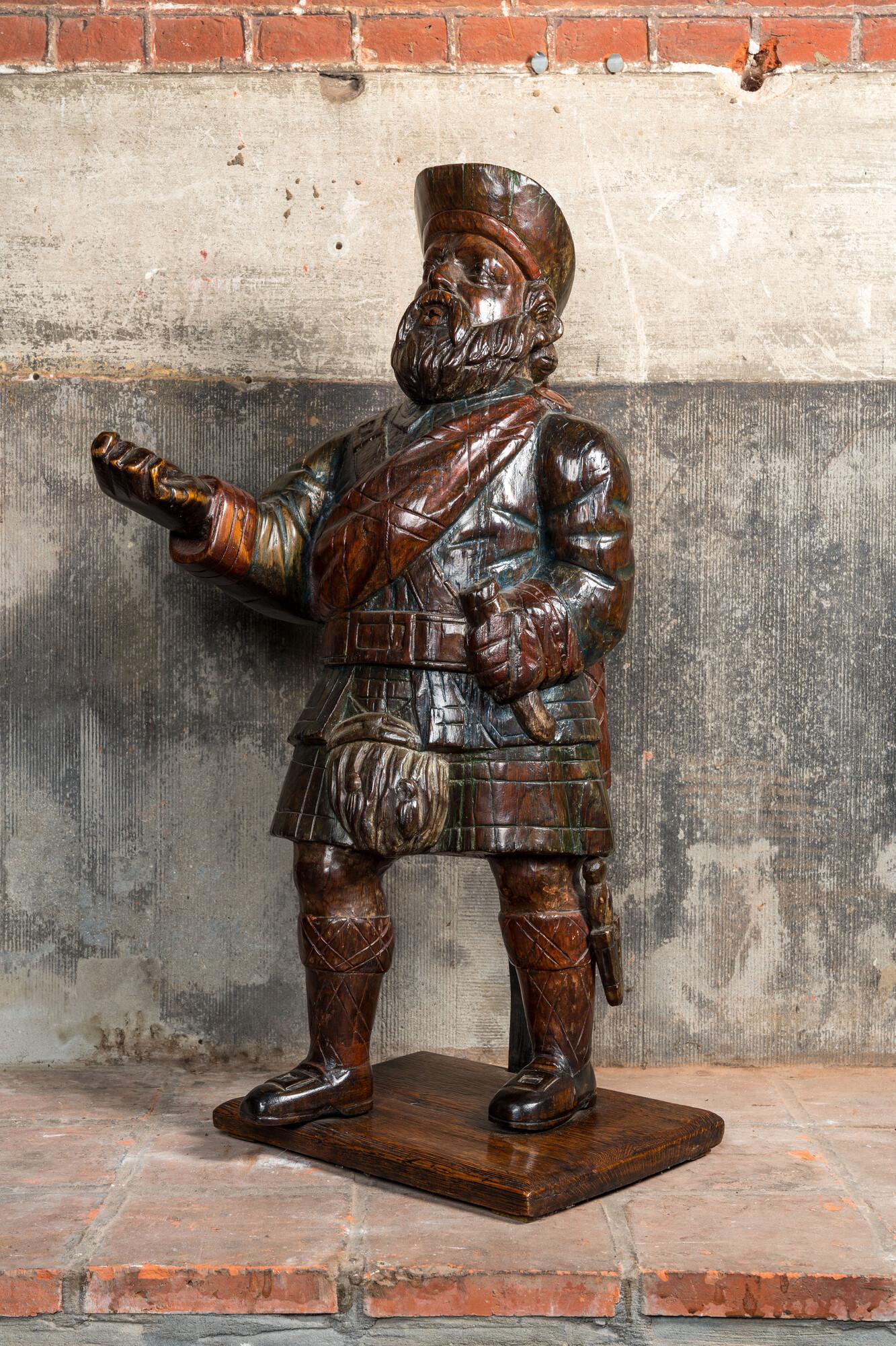 A polychrome wooden figure of a Scottish nobleman, 19th C. (1 of 3)