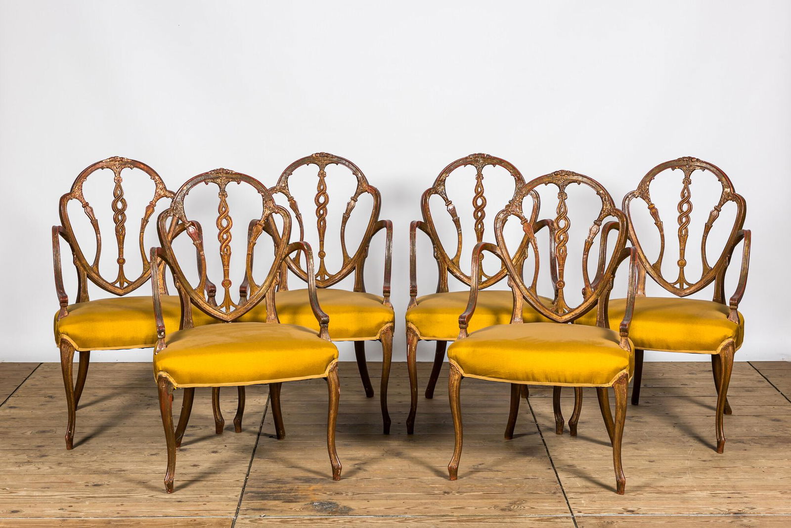 Six English polychrome and partly gilt George Hepplewhite style armchairs, 19th C. (1 of 3)