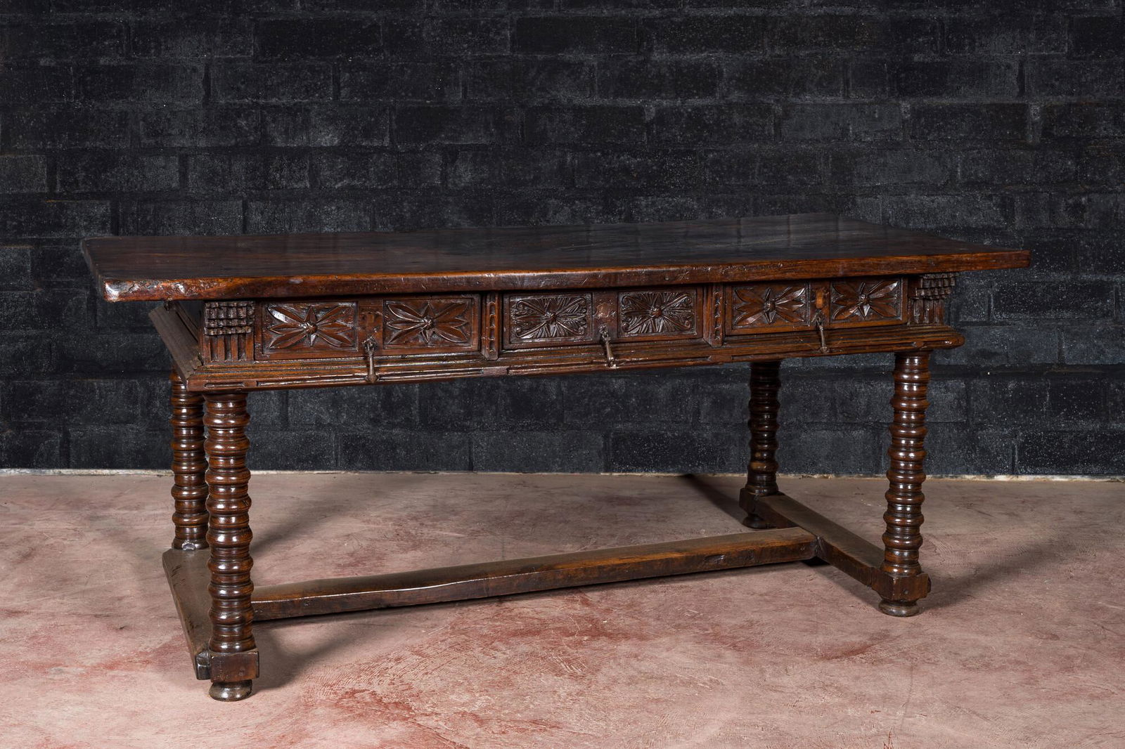 A Spanish walnut table with three drawers, 17th C (1 of 3)