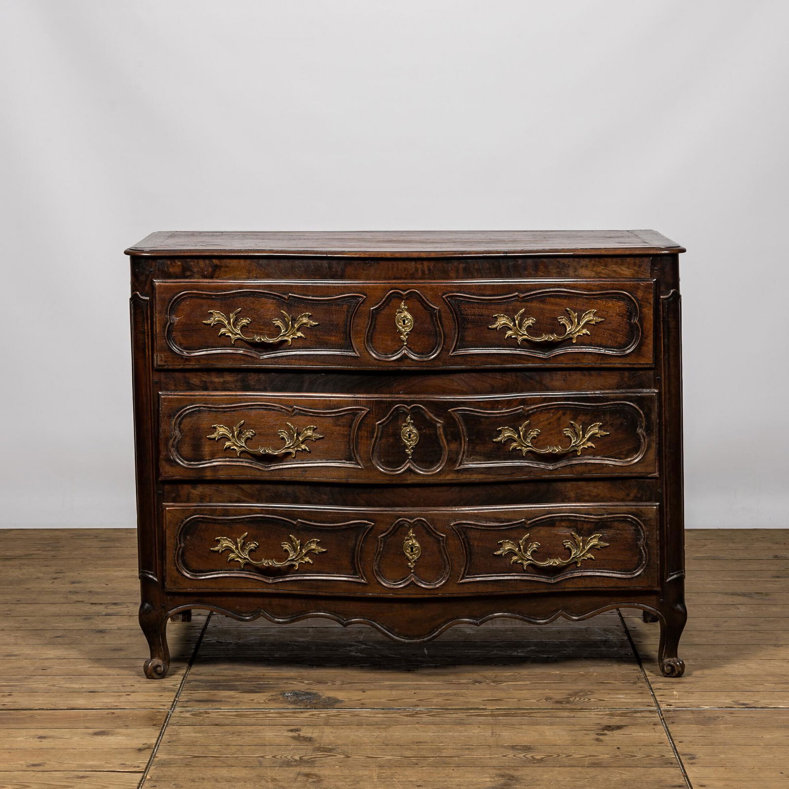 A Louis XV-style walnut chest of drawers, 18th C. (1 of 3)