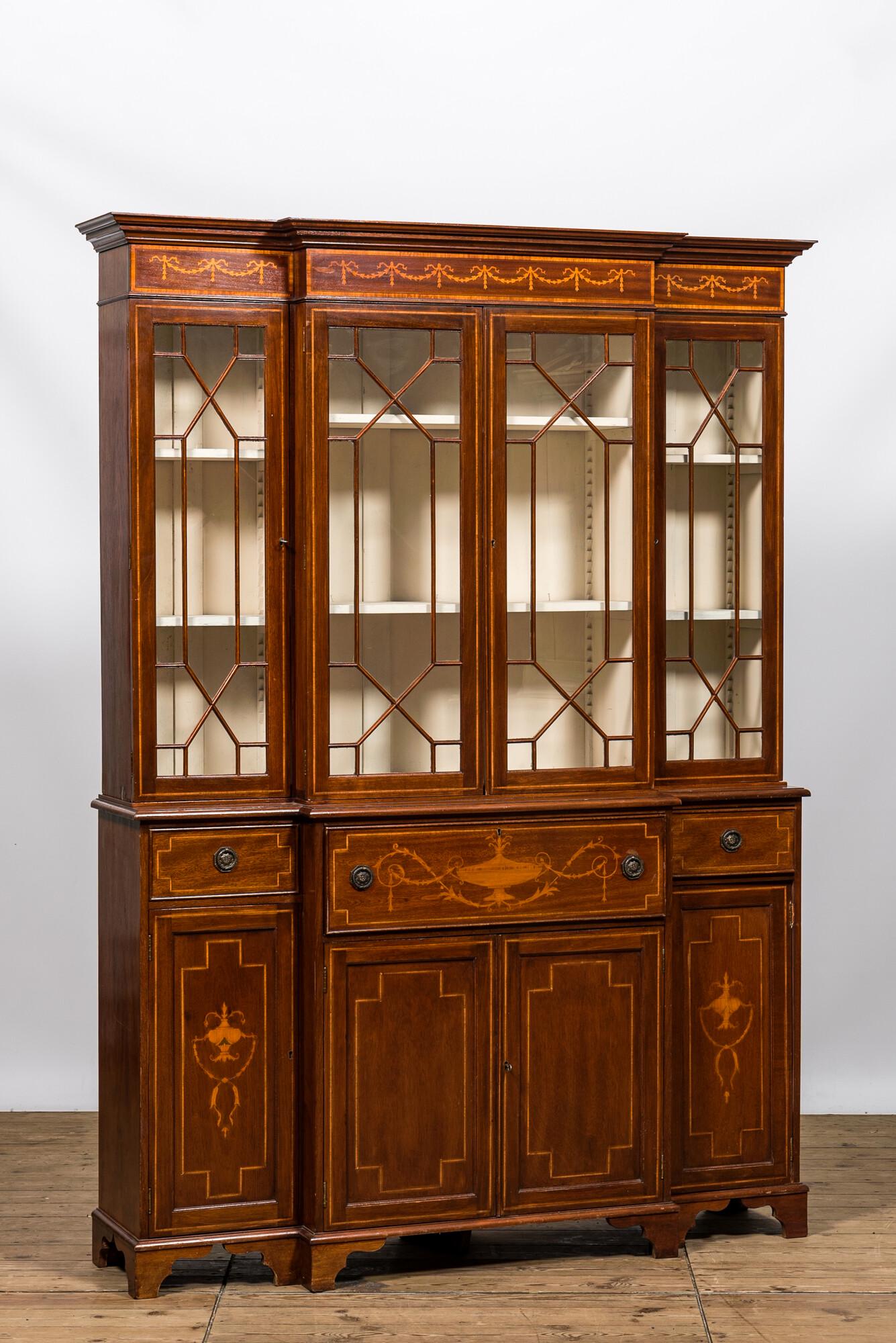 An English neoclassical mahogany marquetry breakfront bookcase, 19/20th C. (1 of 4)