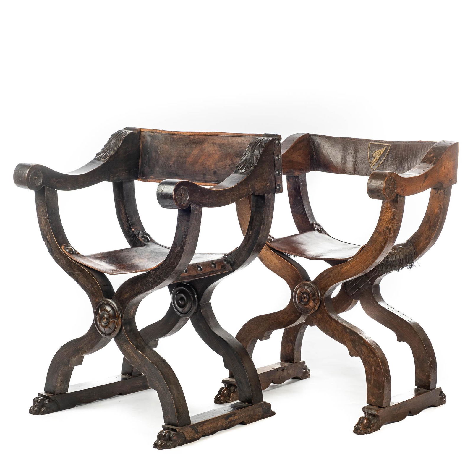 Two leather-mounted wooden 'dagobert' chairs, 19th C. (1 of 5)