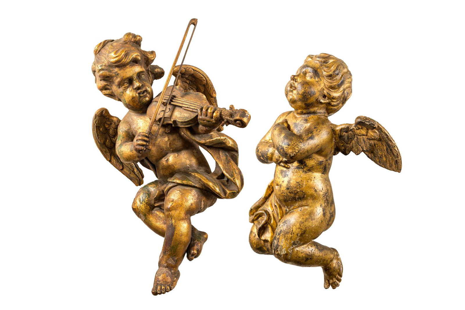 Two gilt wooden angels of which one plays a violin, 19th C. (1 of 3)