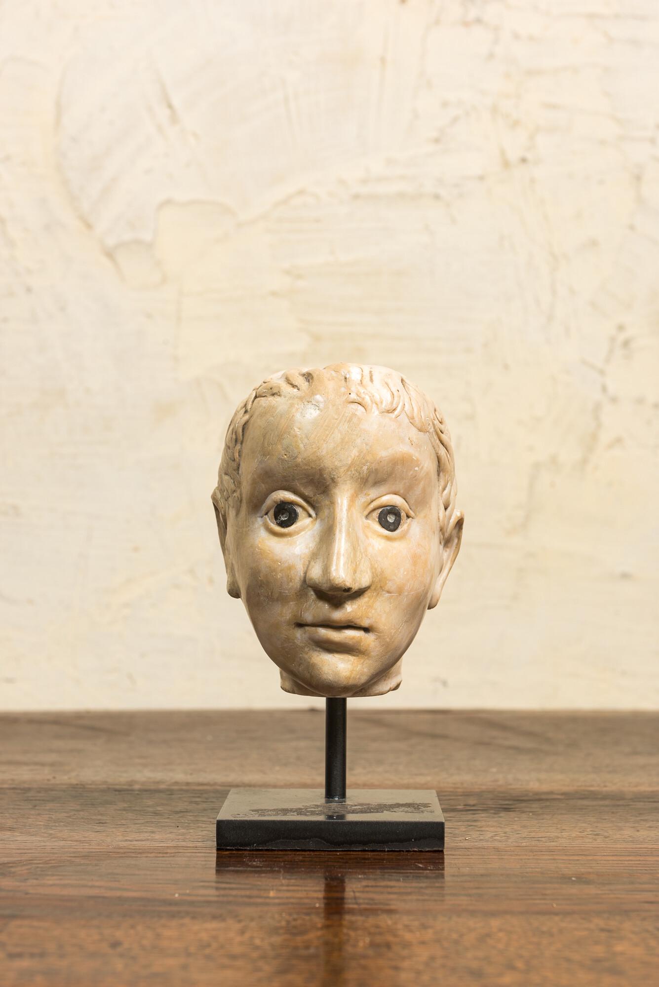 An Italian marble head in Roman style with coins inlaid as eyes, probably 17th C. (1 of 3)