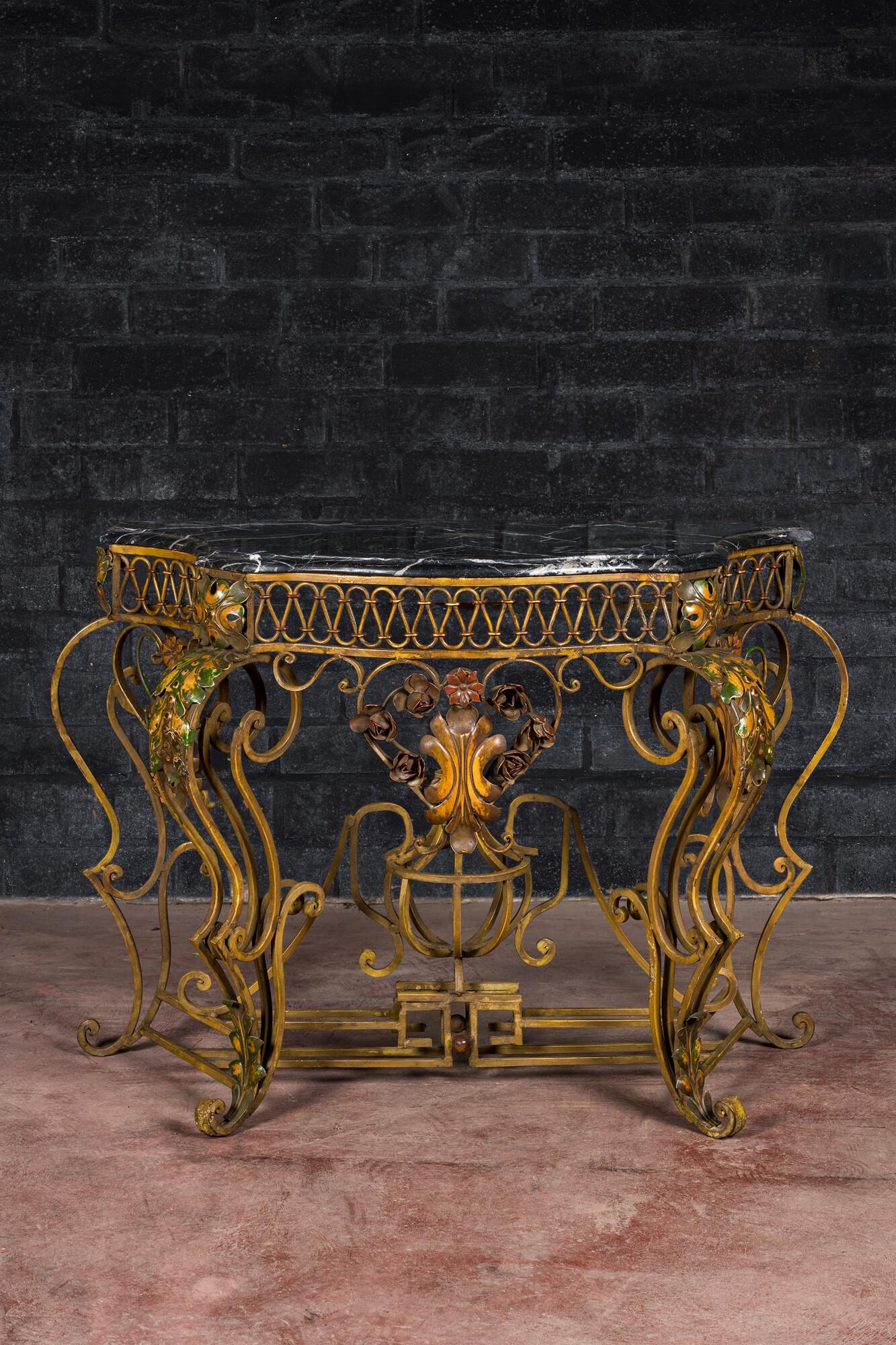 A Louis XV-style polychrome wrought iron console with black marble top, 19th C. (1 of 3)