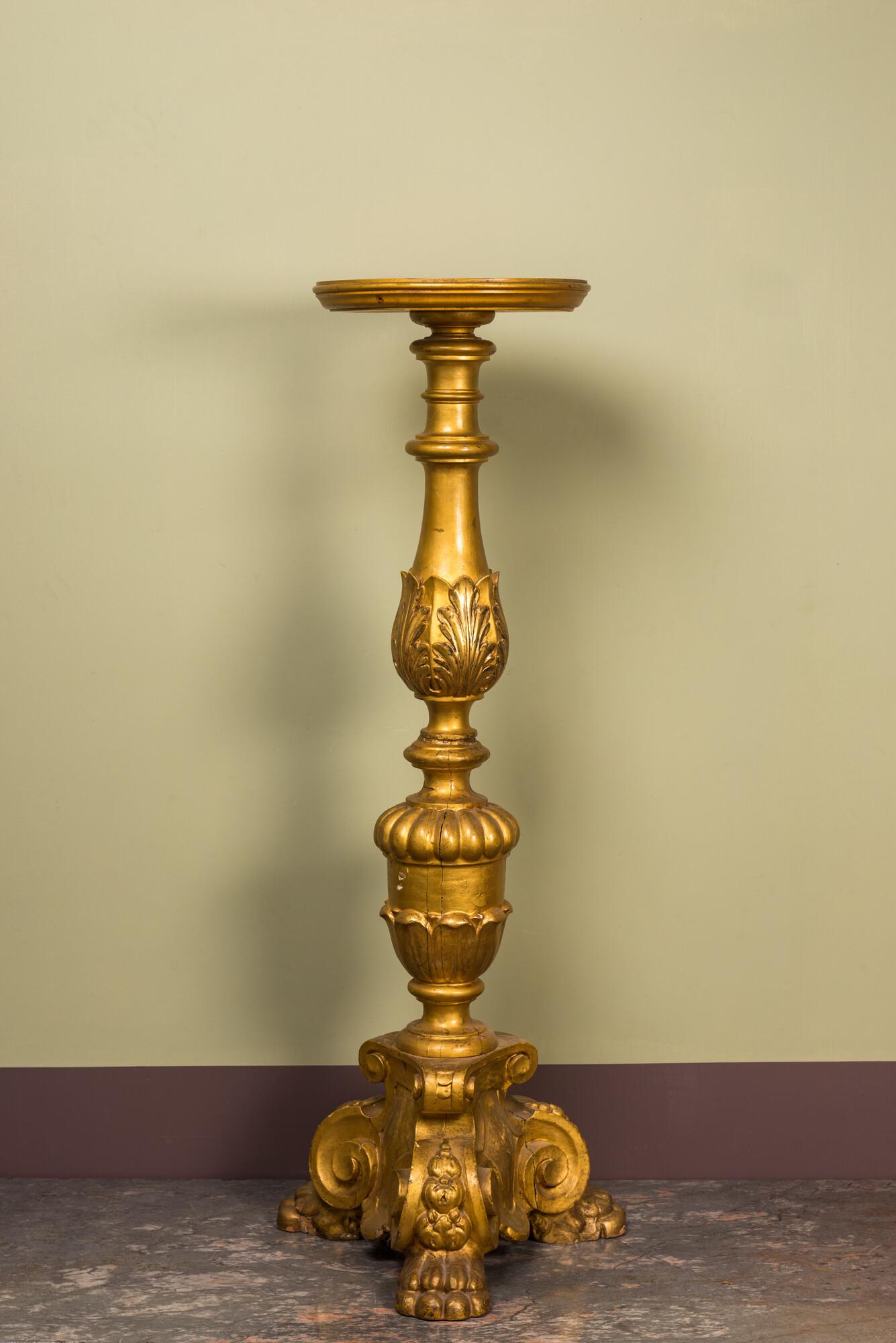 A large Italian gilt wooden pedestal with lion's feet, 19th C. (1 of 2)