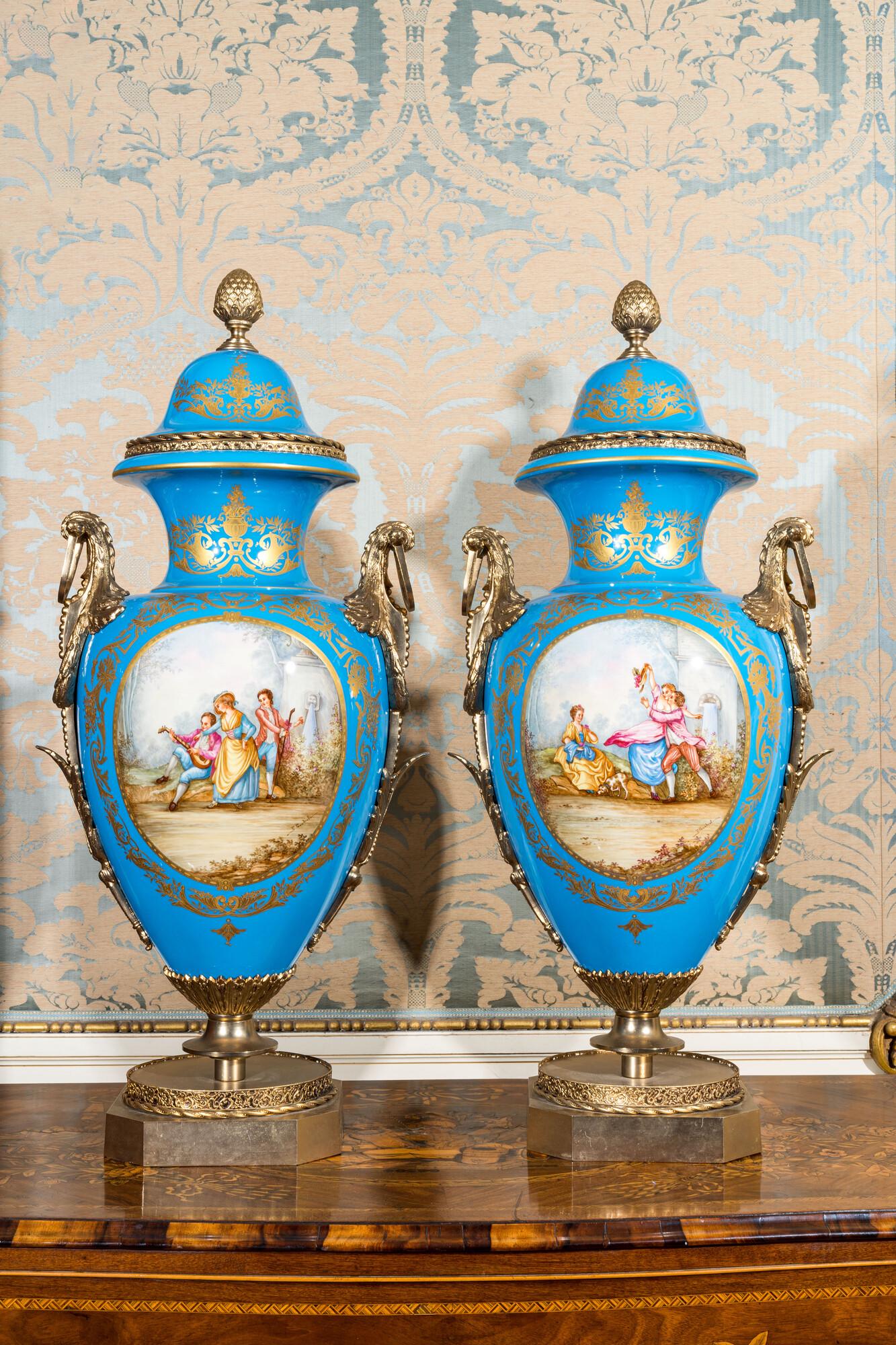 A pair of large Sevres-style lidded vases in 'Bleu celeste' porcelain with gilt bronze mounts, (1 of 4)