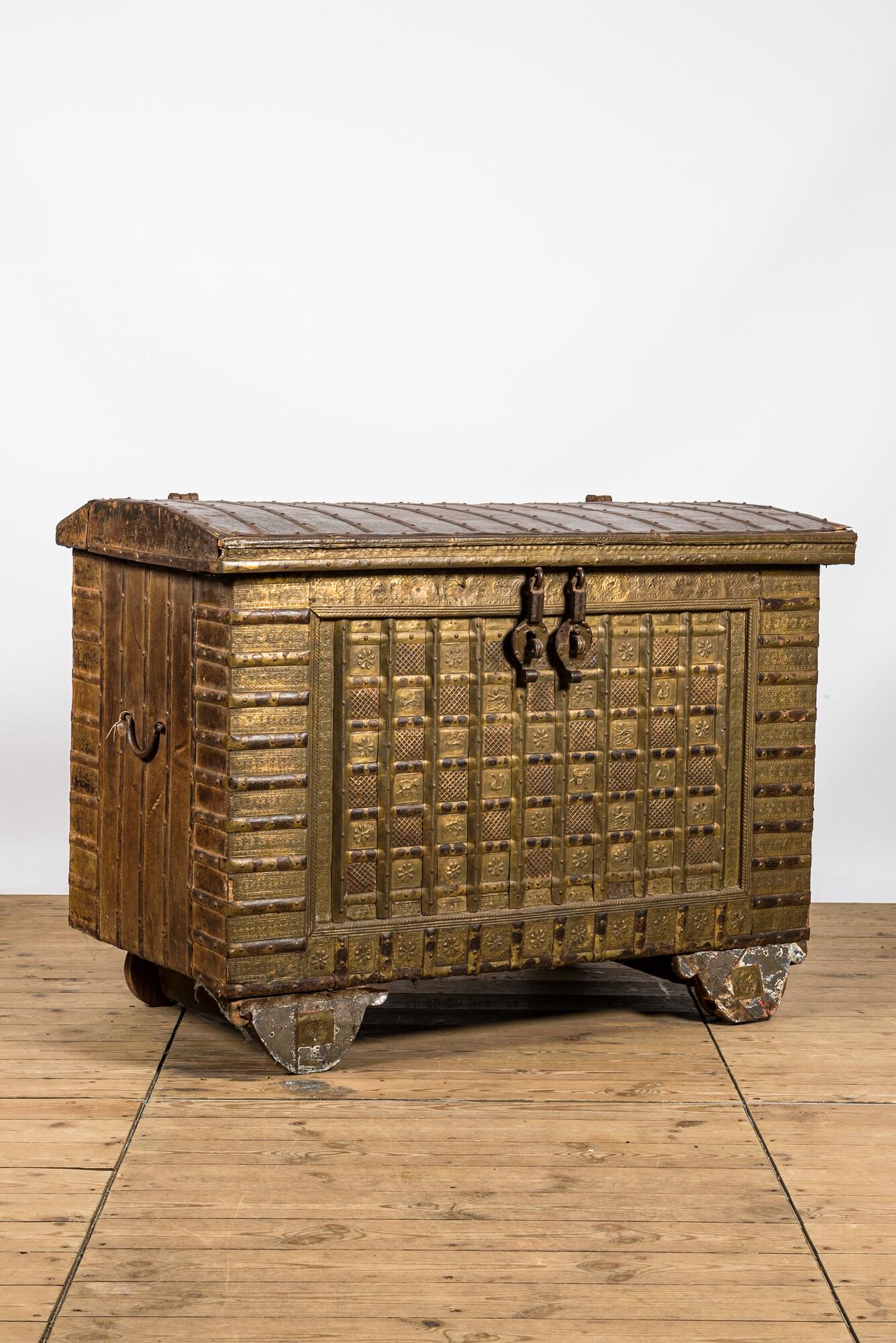 A hammered copper-embellished wooden dowry chest, India, 19/20th C. (1 of 9)