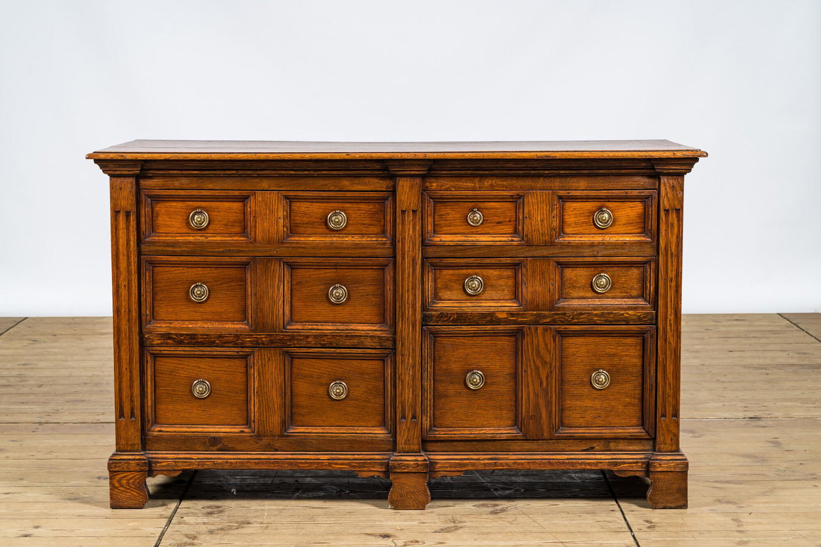 An oak wooden chest of drawers, 19th C. (1 of 3)