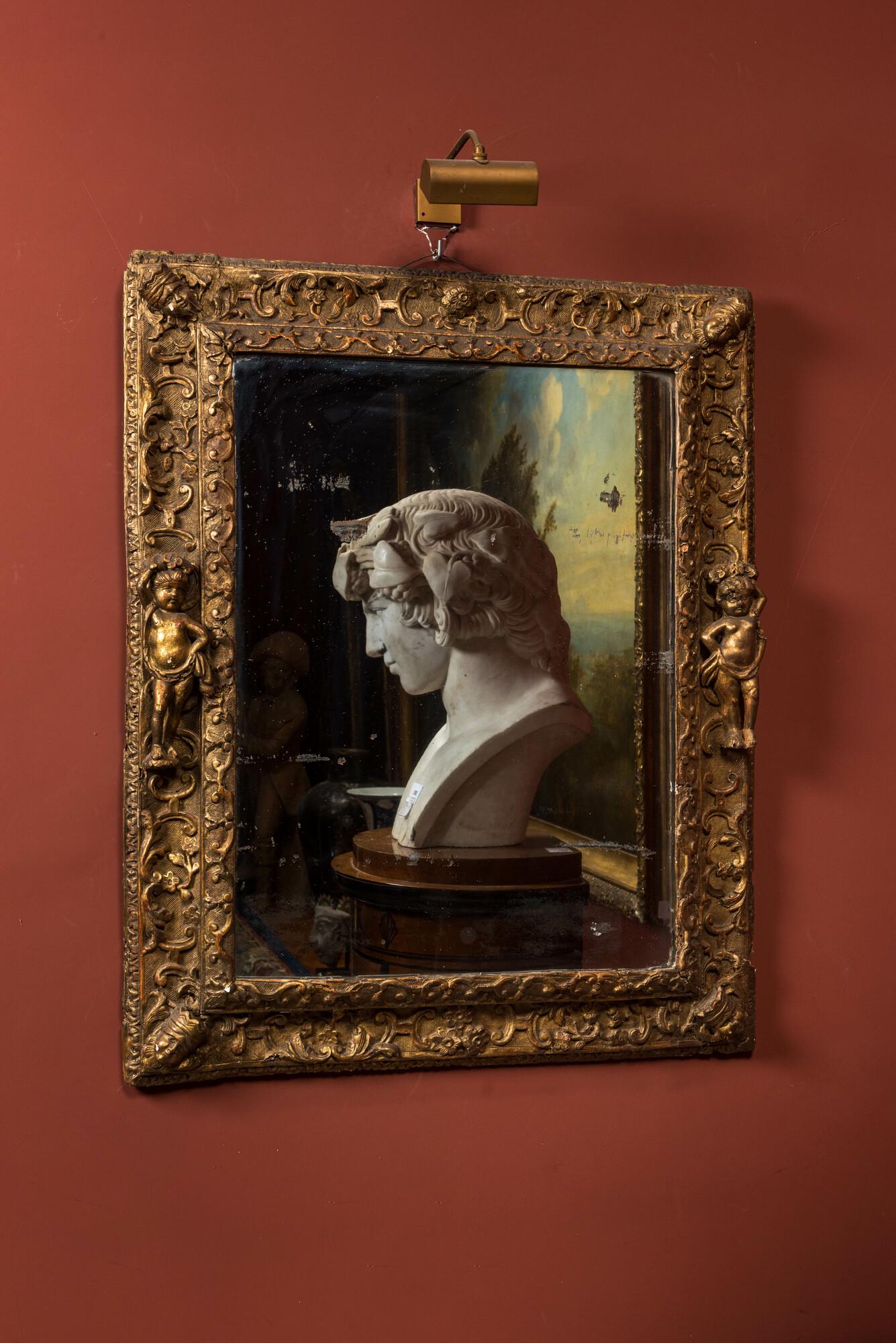 A gilt wooden baroque mirror with putti, 18th C. (1 of 3)