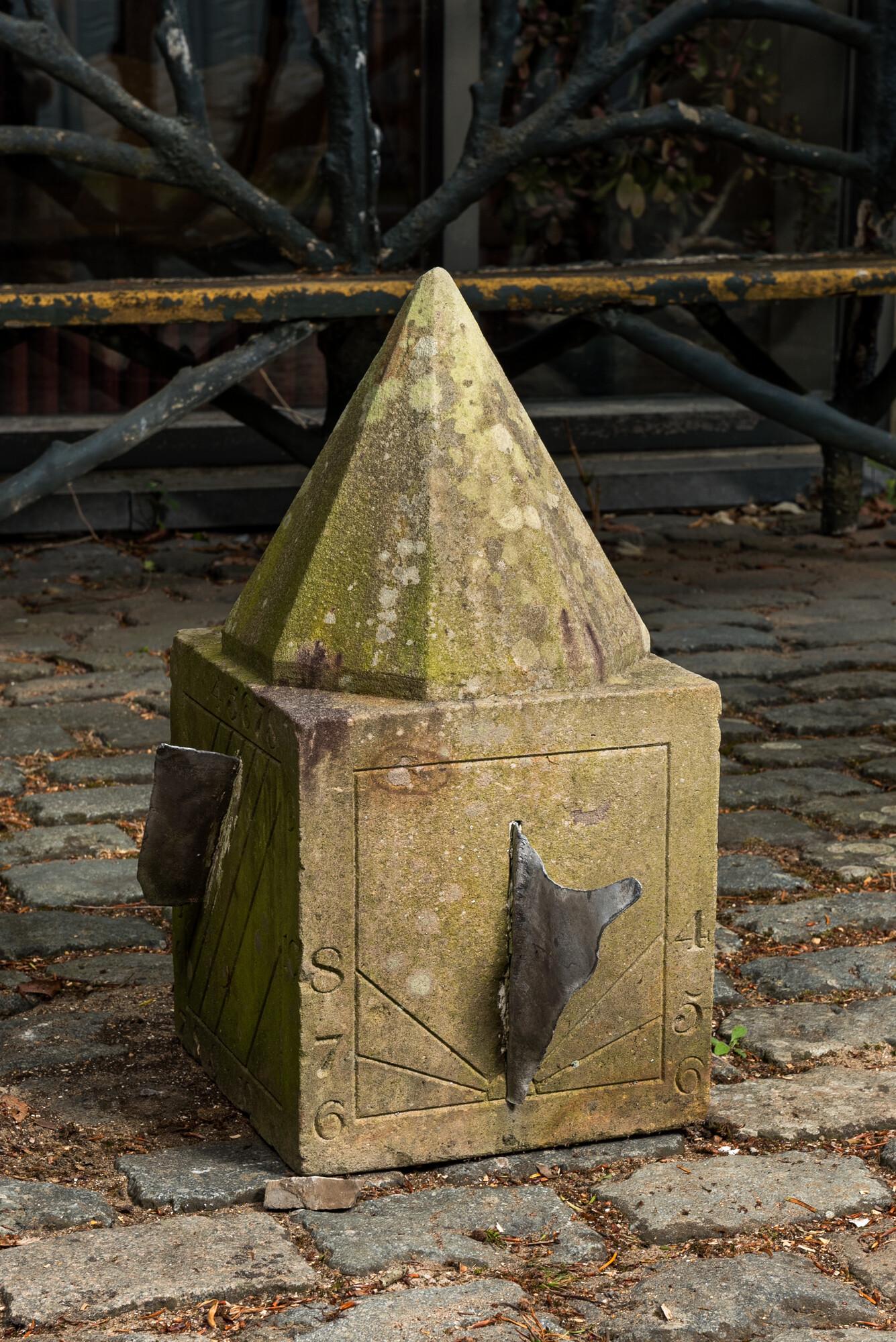 A carved stone sundial with lead indicators, 19th C. (1 of 5)