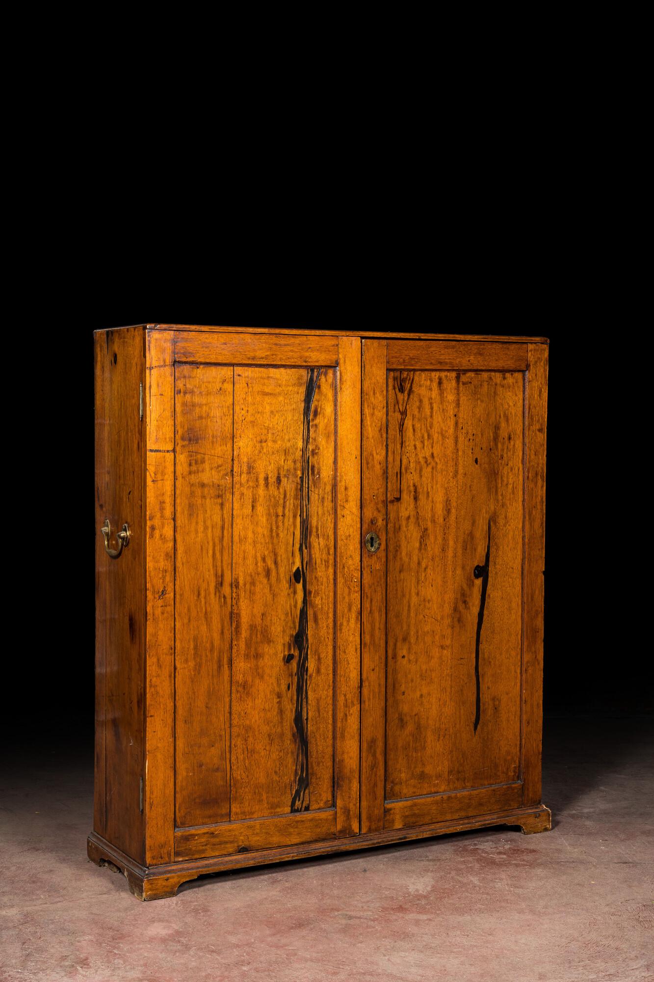 A walnut two-door cupboard, 19th C. (1 of 3)