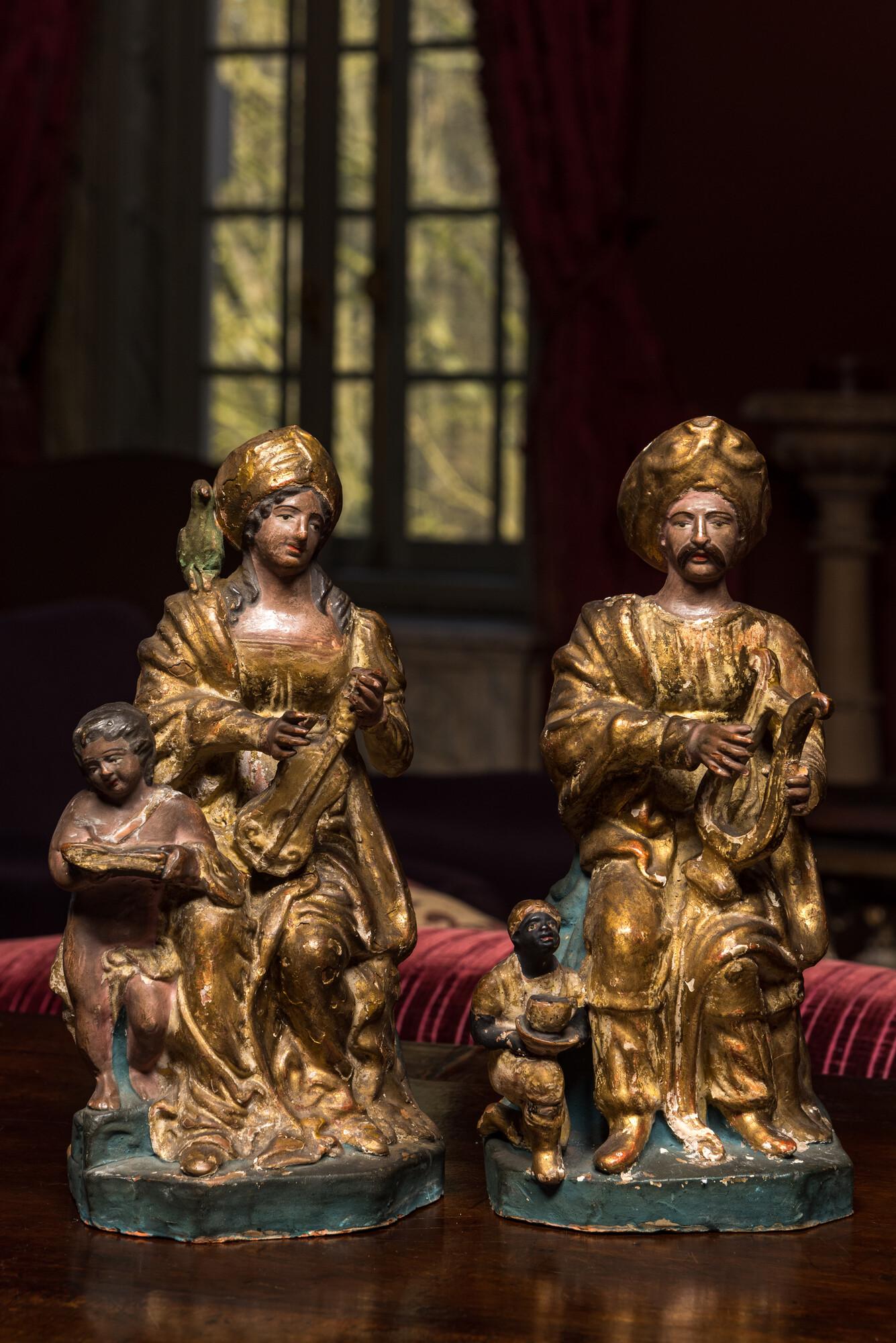 A pair of polychromed and gilt terracotta figures of a Moorish couple playing music, Italy, 18/19th (1 of 2)