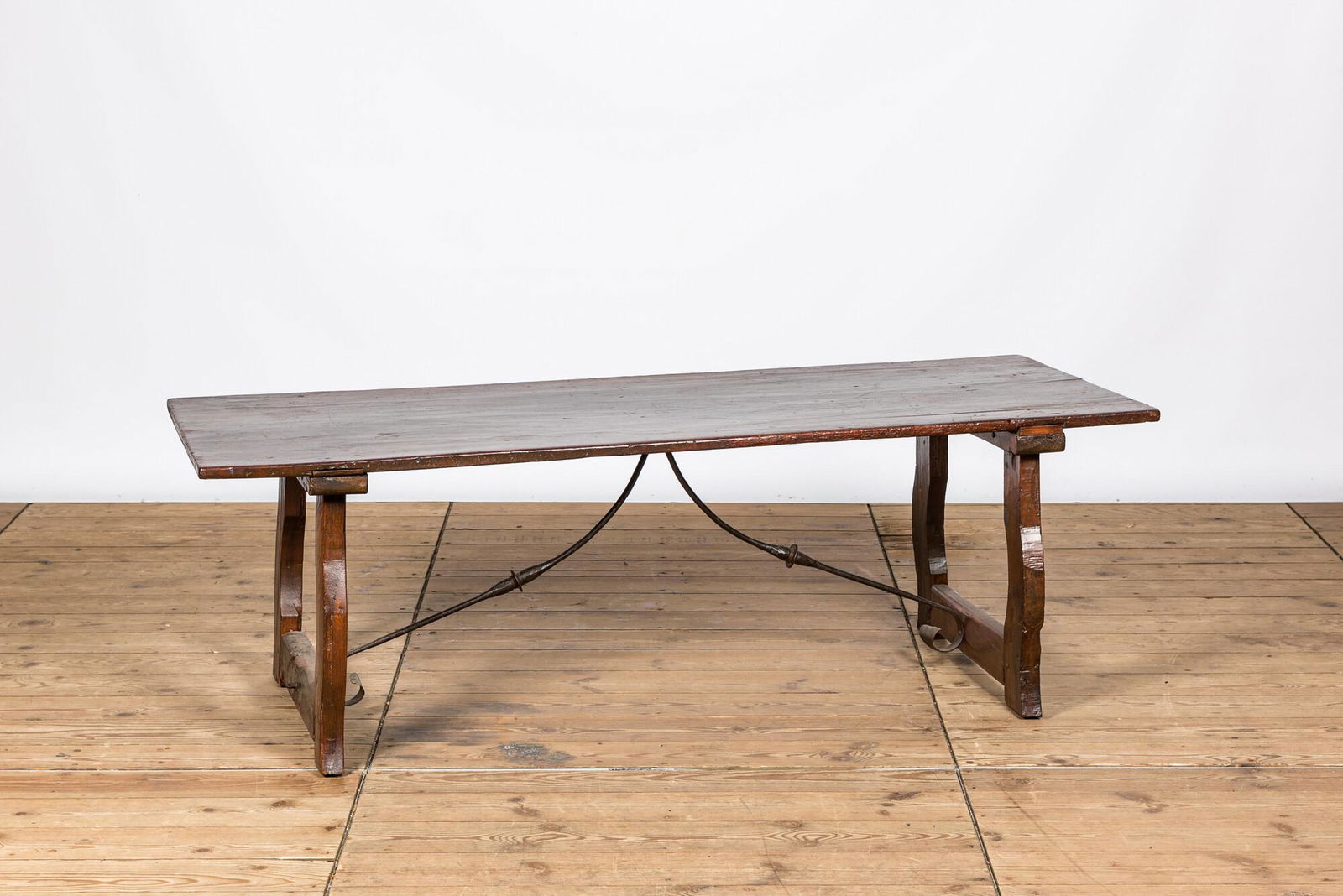 A Spanish wrought iron mounted wooden table, 19th C. (1 of 2)