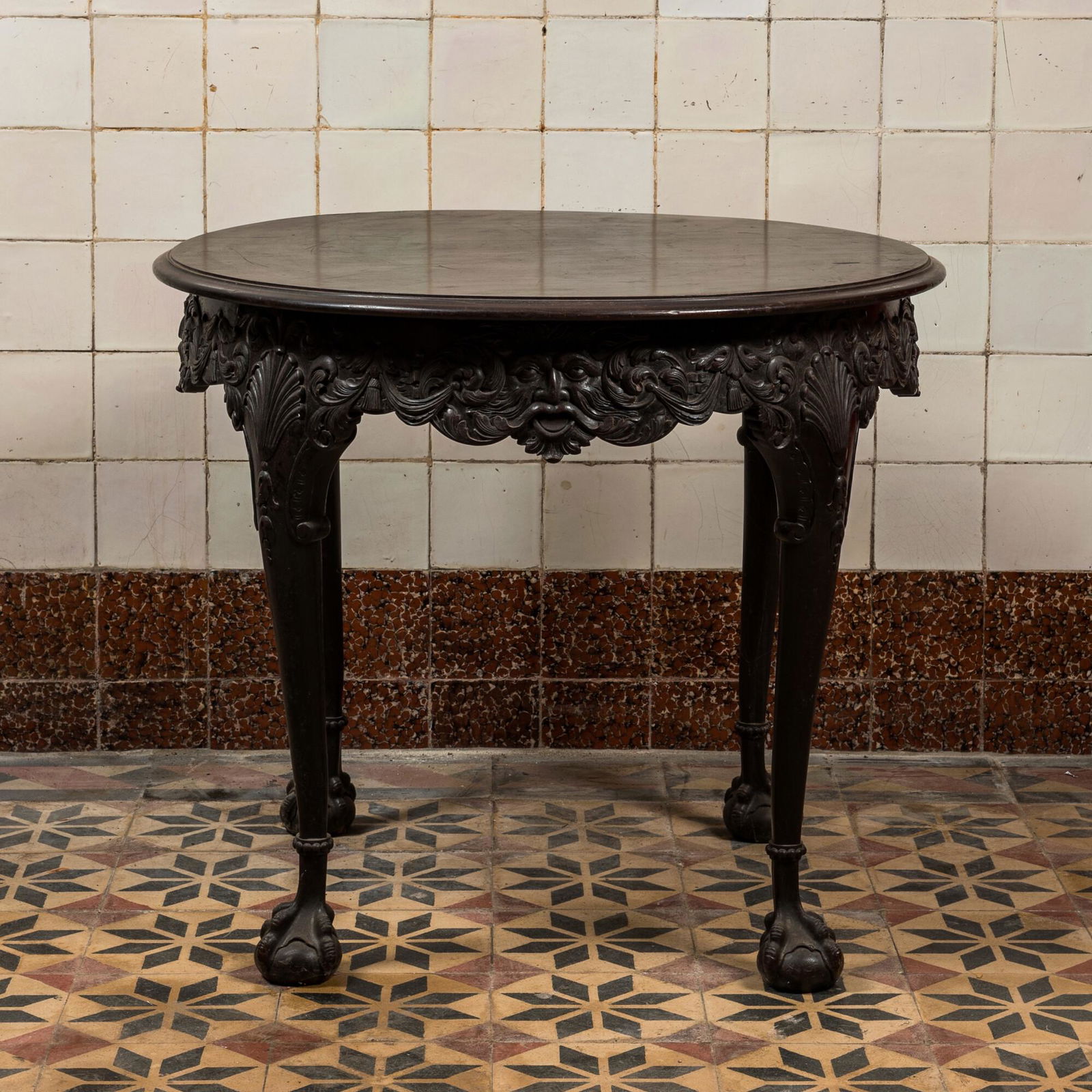 A carved and patinated wooden side table with mascarons in neobaroque-style, 19th C. (1 of 3)