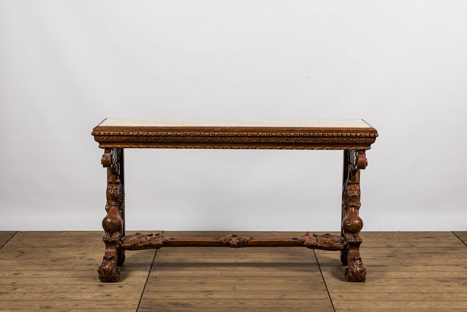 A richly carved wooden wall console with marble top, 19th C. (1 of 4)
