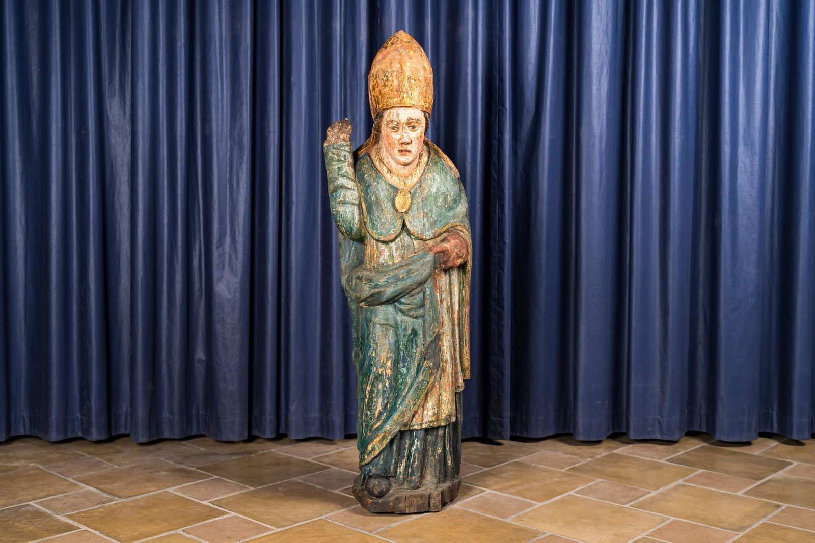 A polychrome wooden figure of a bishop, 16th C. (1 of 4)