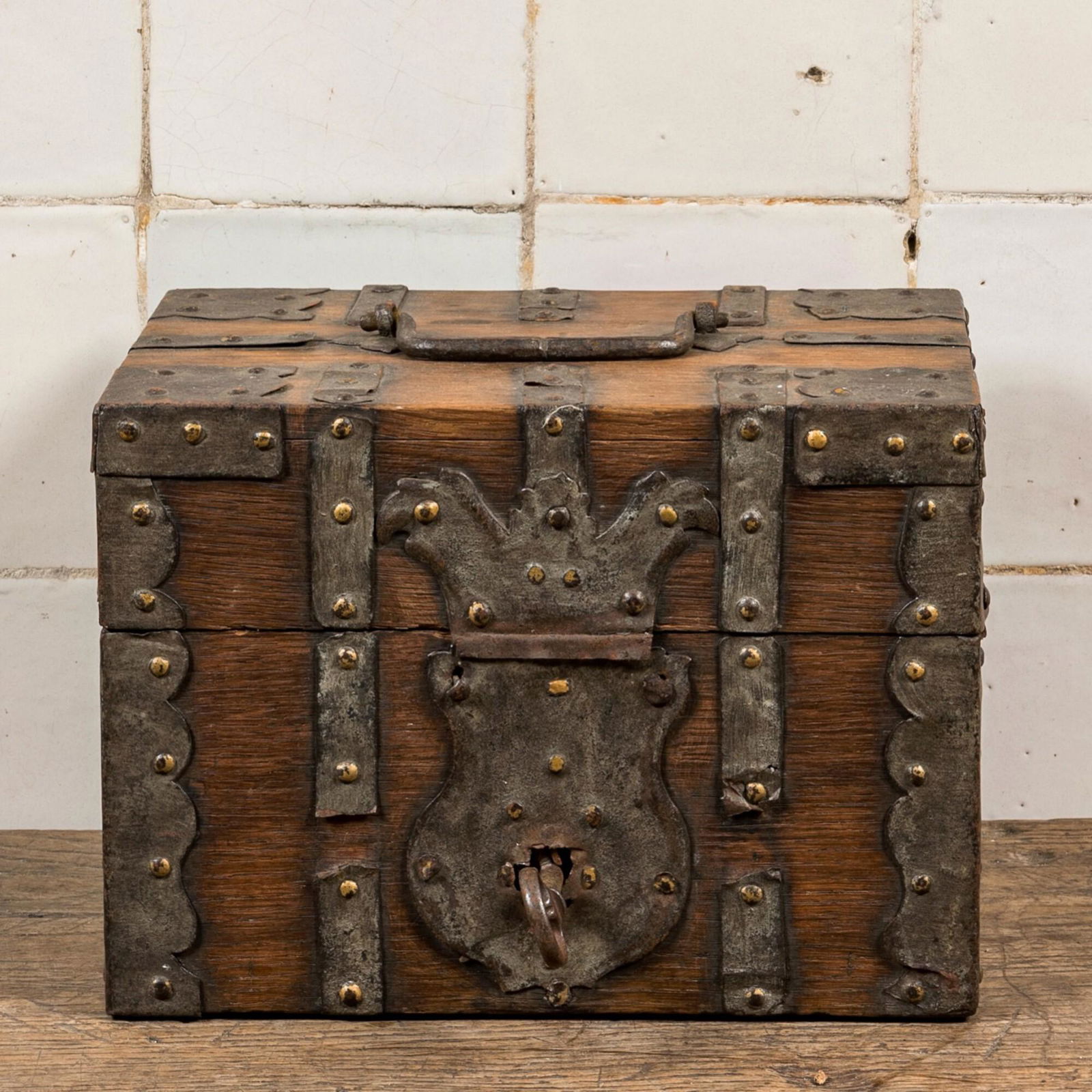 A wrought iron-mounted wooden box, 19th C. (1 of 2)