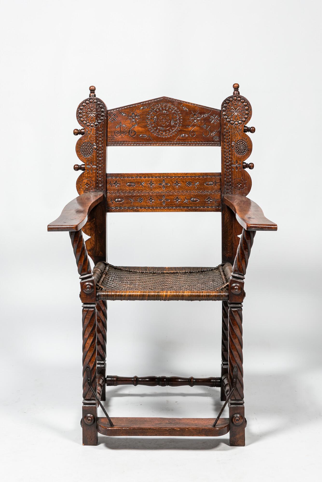 A walnut armchair with wicker upholstery, 19th C. (1 of 3)