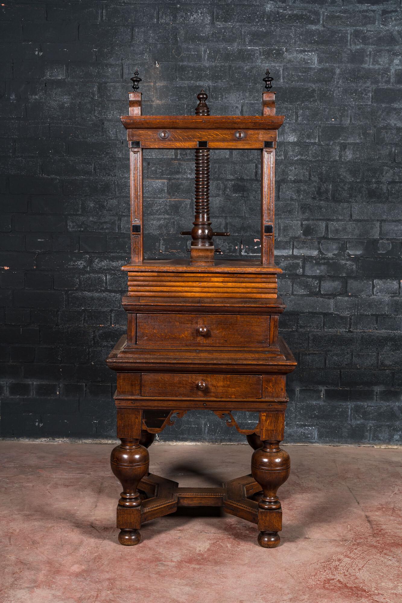 An oak linen press on foot with ebonised accents, 19th C. (1 of 2)