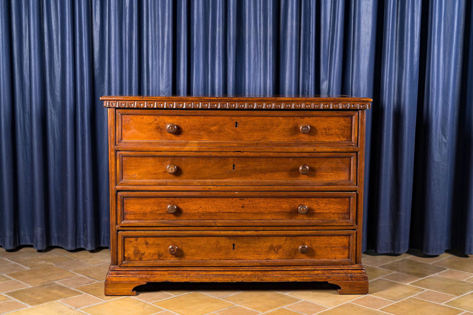 A walnut four-drawer commode, 19th C. (1 of 3)
