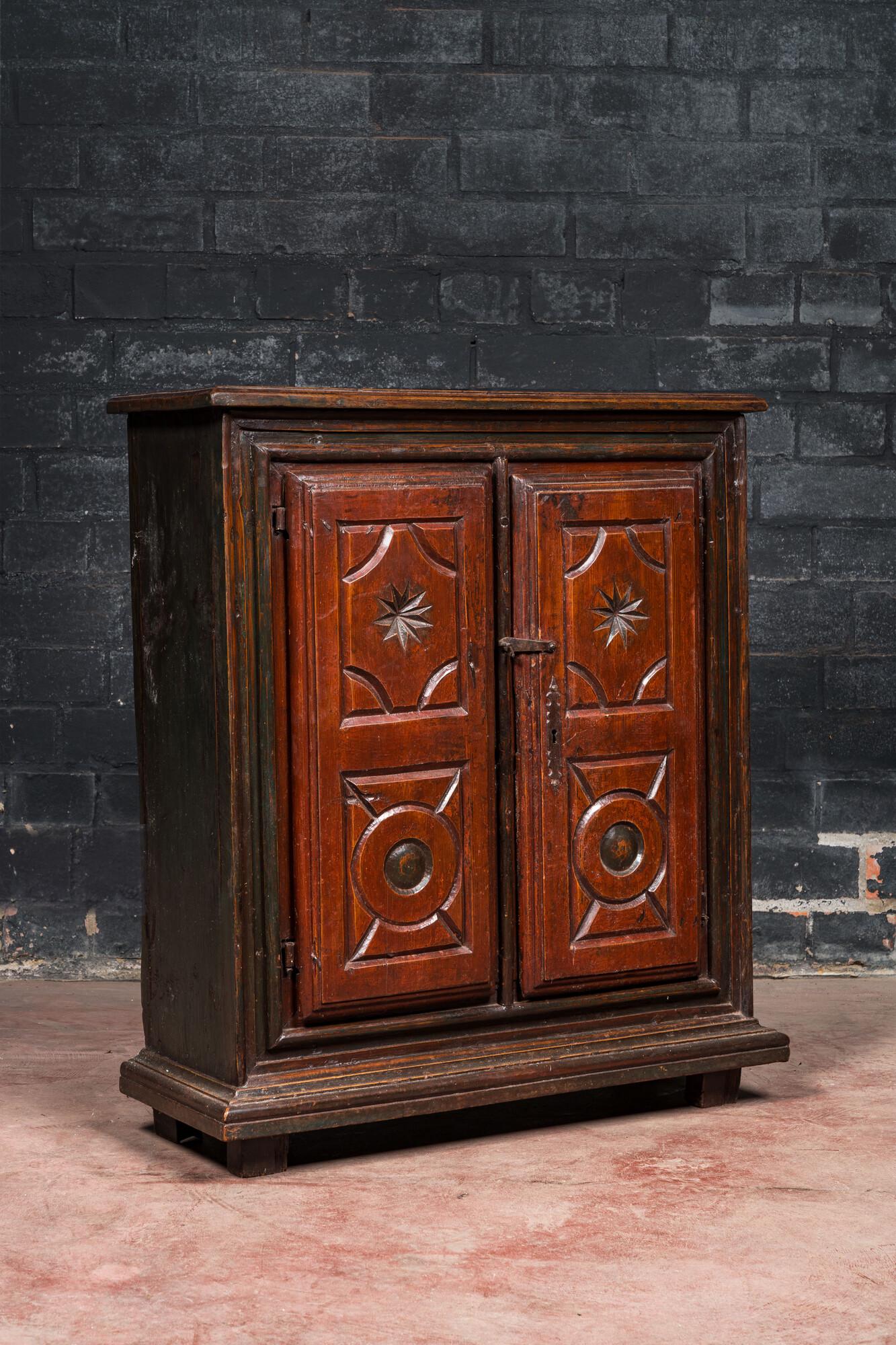 A polychromed walnut and pine wood two-door cupboard, probably Germany, 19th C. (1 of 3)