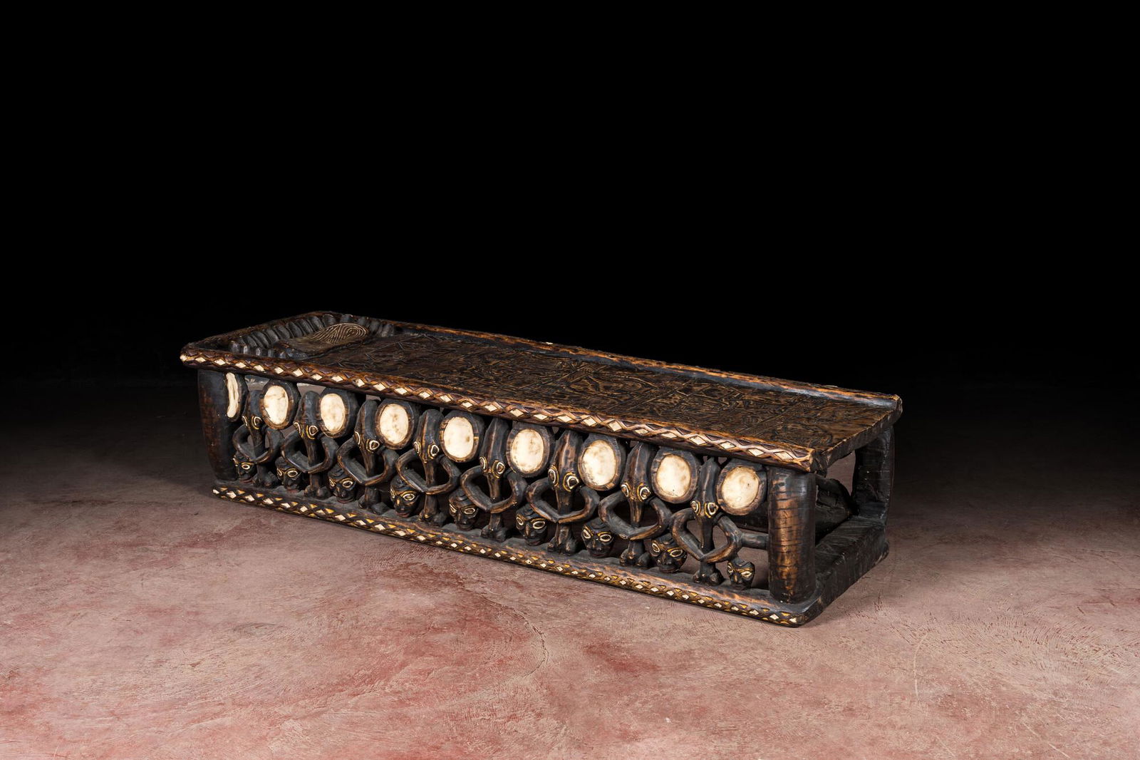 A Bamileke patinated wooden richly decorated bed, Cameroon, 20th C. (1 of 7)