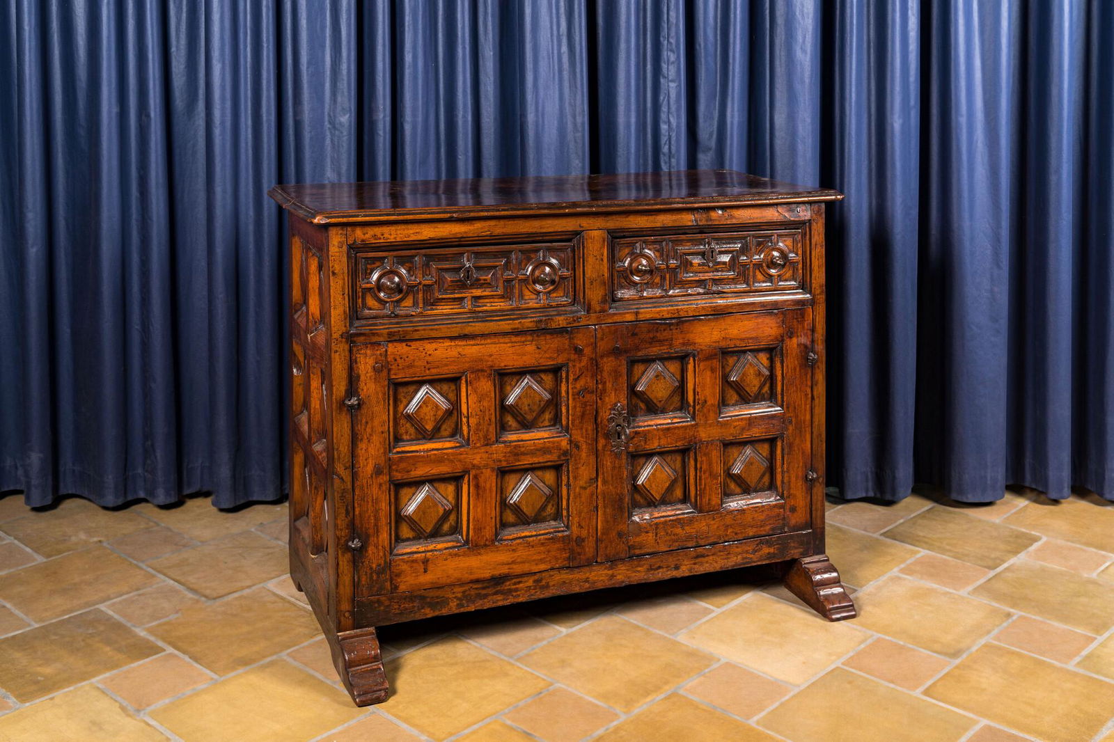 A Spanish walnut dresser with two doors and two drawers, 17th C. (1 of 4)