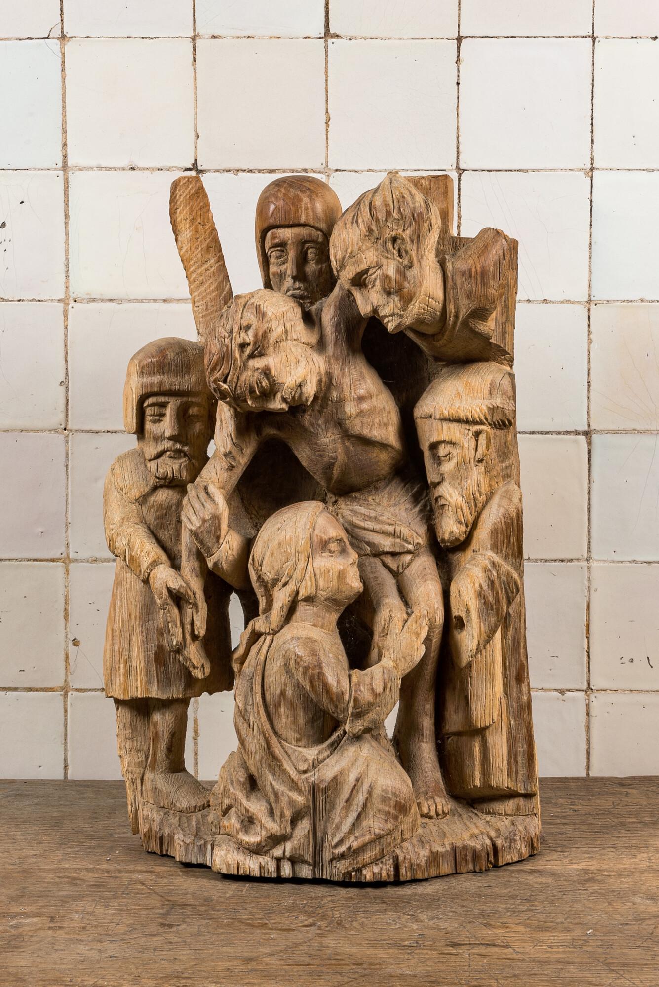 An oak 16th C. style group with the 'Descent from the Cross', 20th C. (1 of 3)