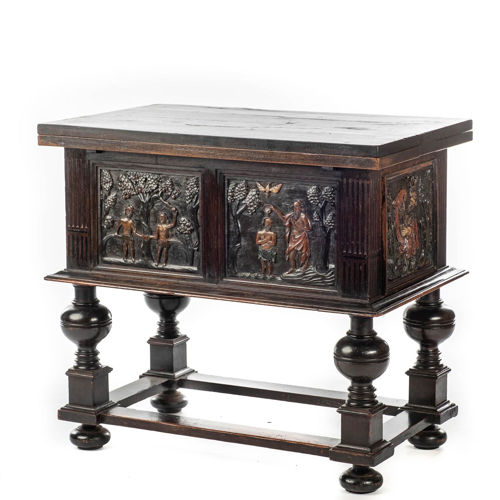 A rare ebonised wooden baluster leg table with polychromed reliefs, 17th C. with later elements (1 of 6)
