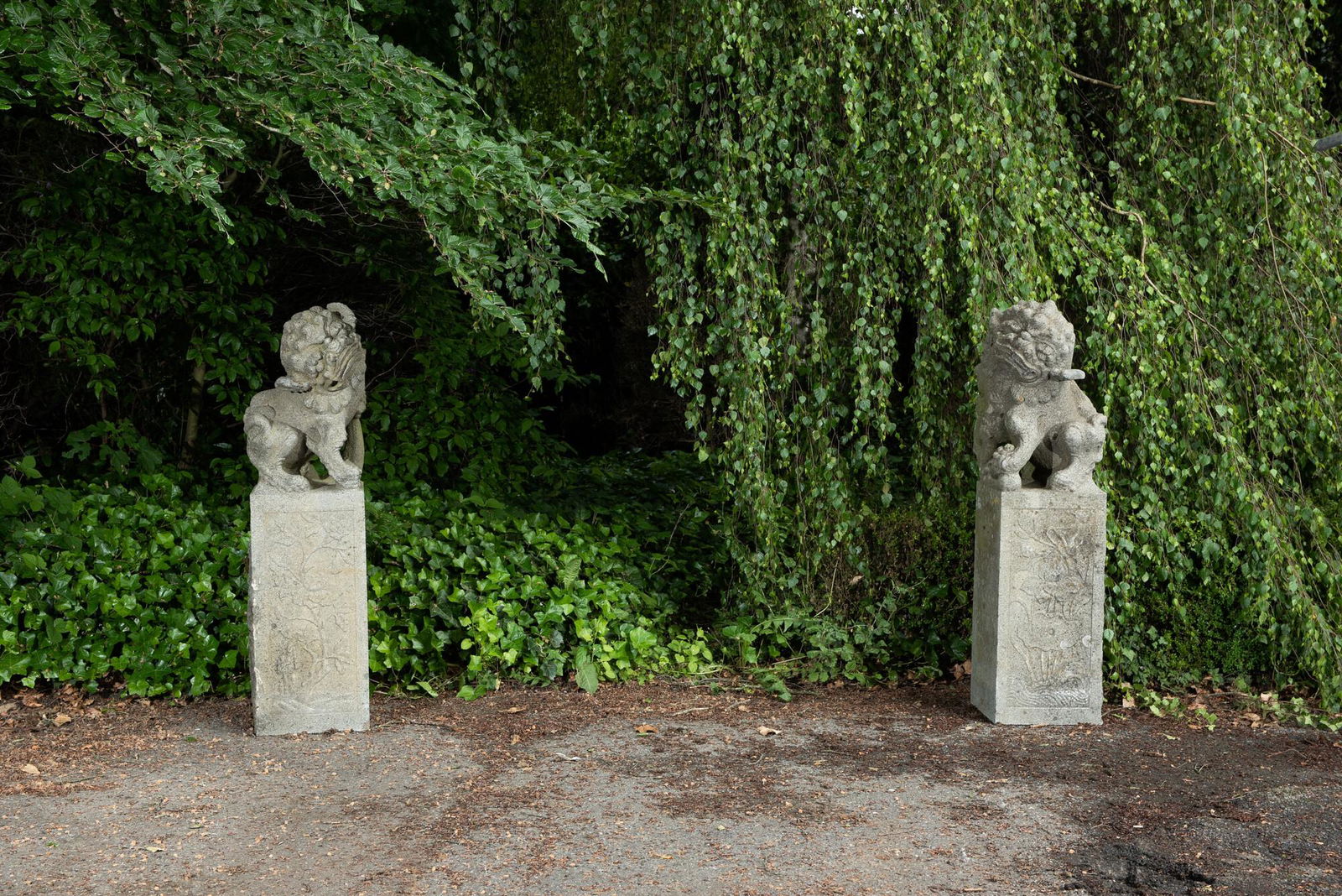 A pair of Chinese Ming-style basalt stone sculptures, 19/20th C. (1 of 5)