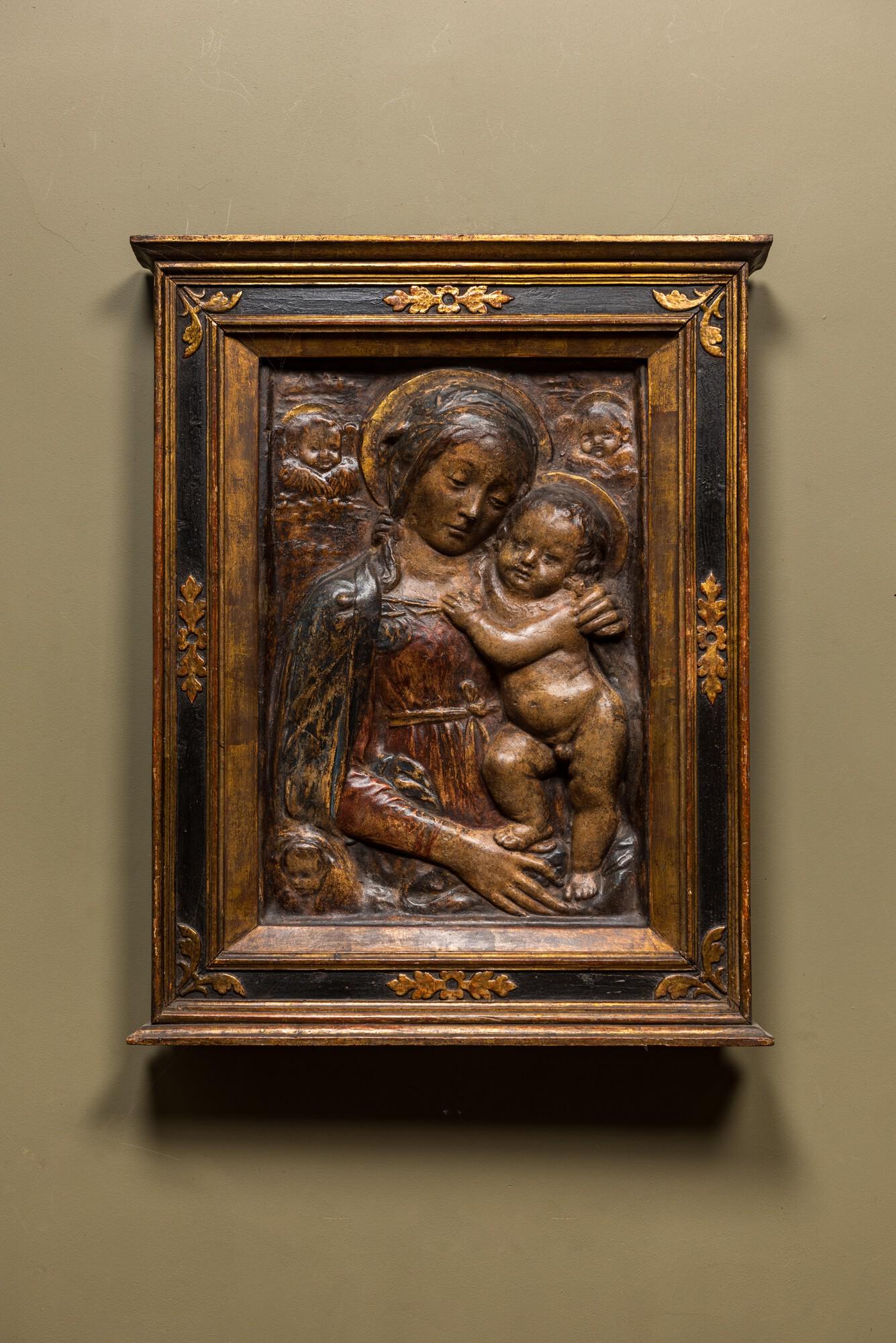 An Italian polychrome stucco relief with Madonna with Child, possibly Florence, 16/17th C. (1 of 2)