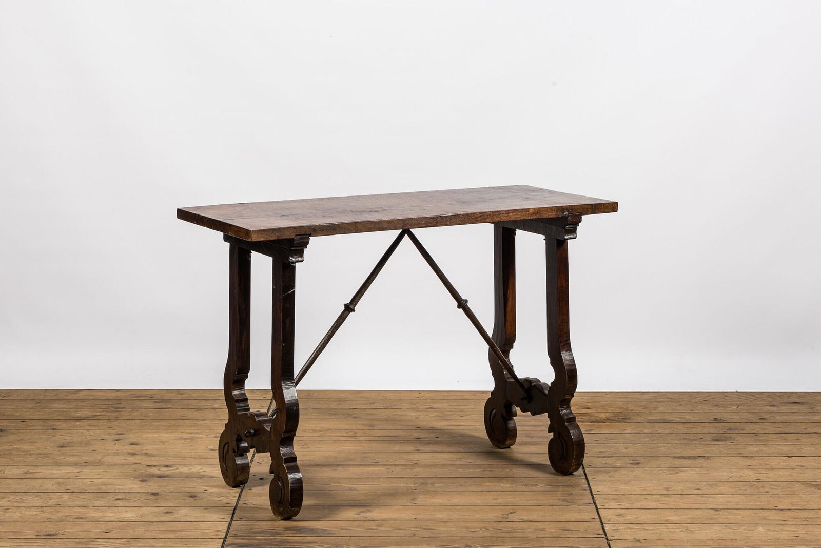 A Spanish walnut table with wrought iron connection, 19th C. (1 of 4)