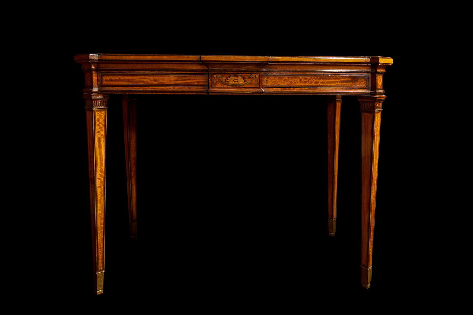 An inlaid wooden Empire-style table with brass mounts on the legs, probably France, 19th C. (1 of 3)