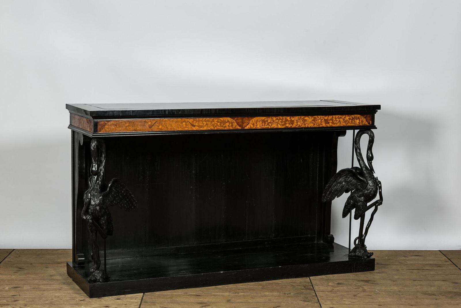 An ebonised and inlaid wooden console with swans, 19th C. (1 of 3)