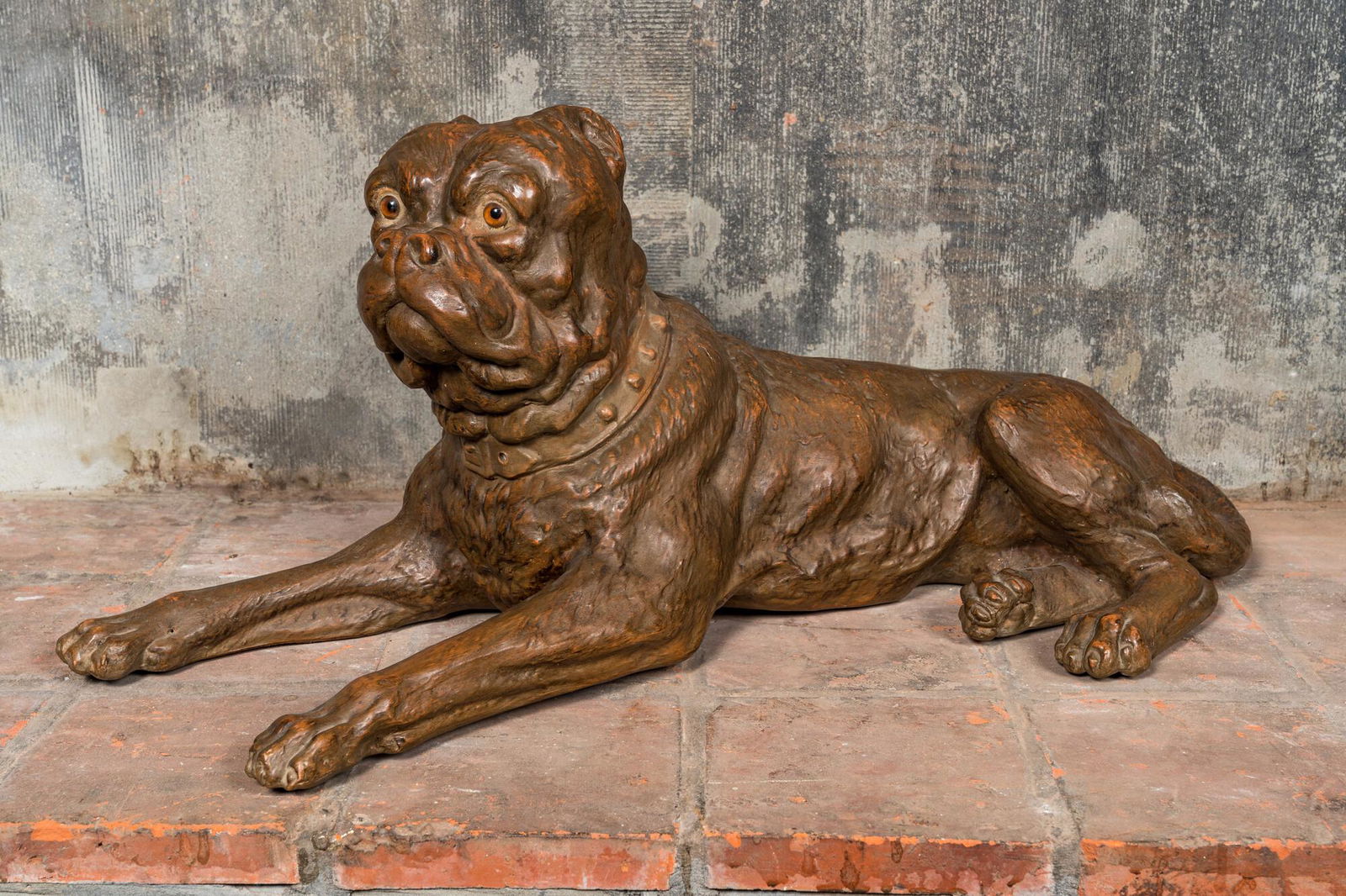 A large brown patinated terracotta model of a bulldog, 20th C. (1 of 3)