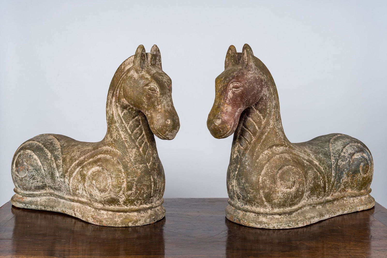 A pair of patinated terracotta horses in Chinese Han-style, 20th C. (1 of 2)