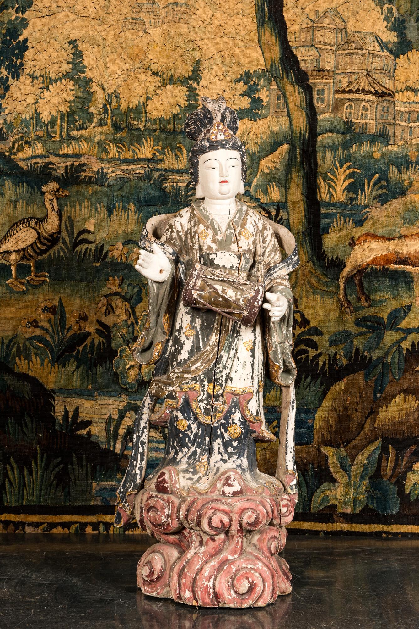 A large Chinese polychrome wooden sculpture of Guanyin, 20th C. (1 of 3)