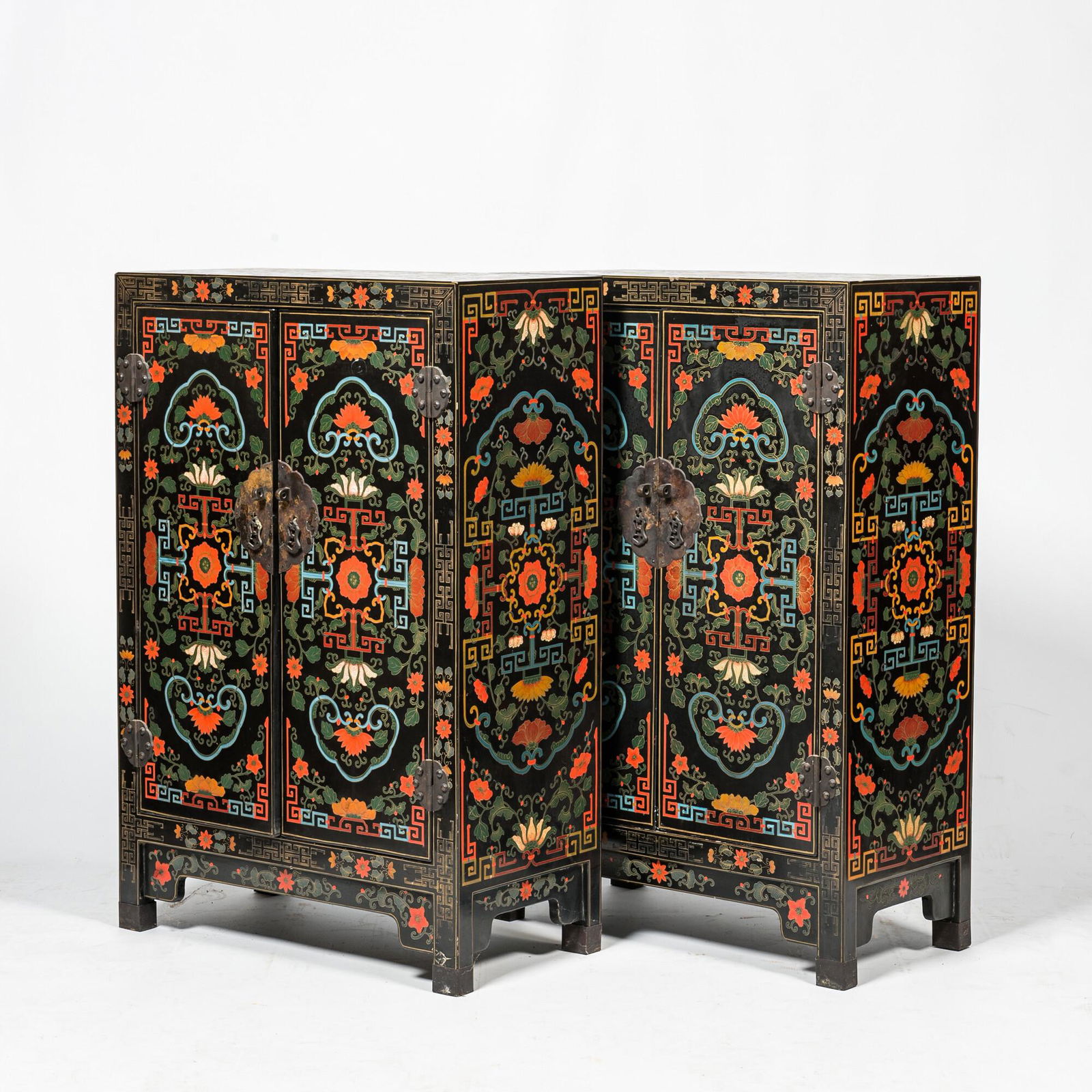 A pair of Chinese black lacquered wooden two-door cabinets with floral design, 20th C. (1 of 3)
