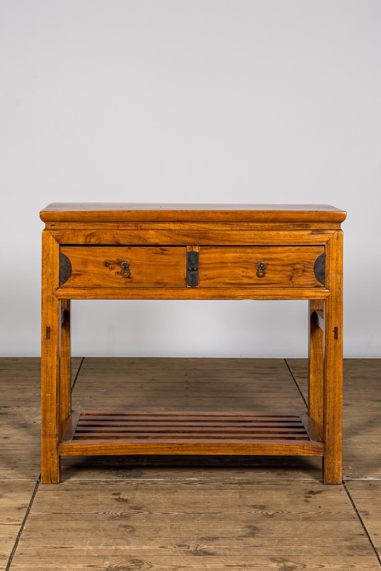 A Chinese wooden console with two drawers, 20th C. (1 of 3)