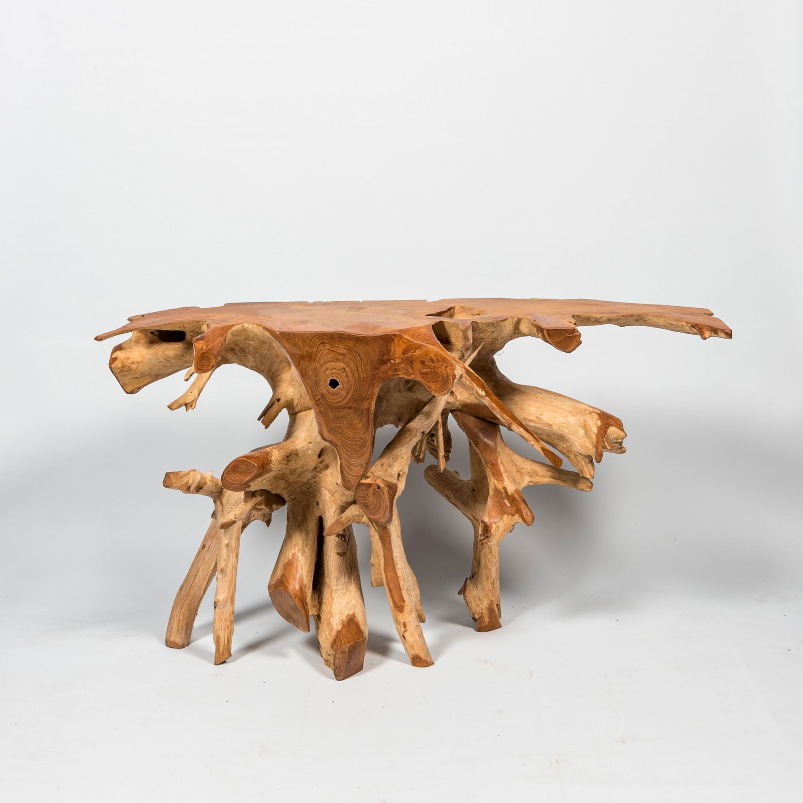 A burl wood console, 20th C. (1 of 2)