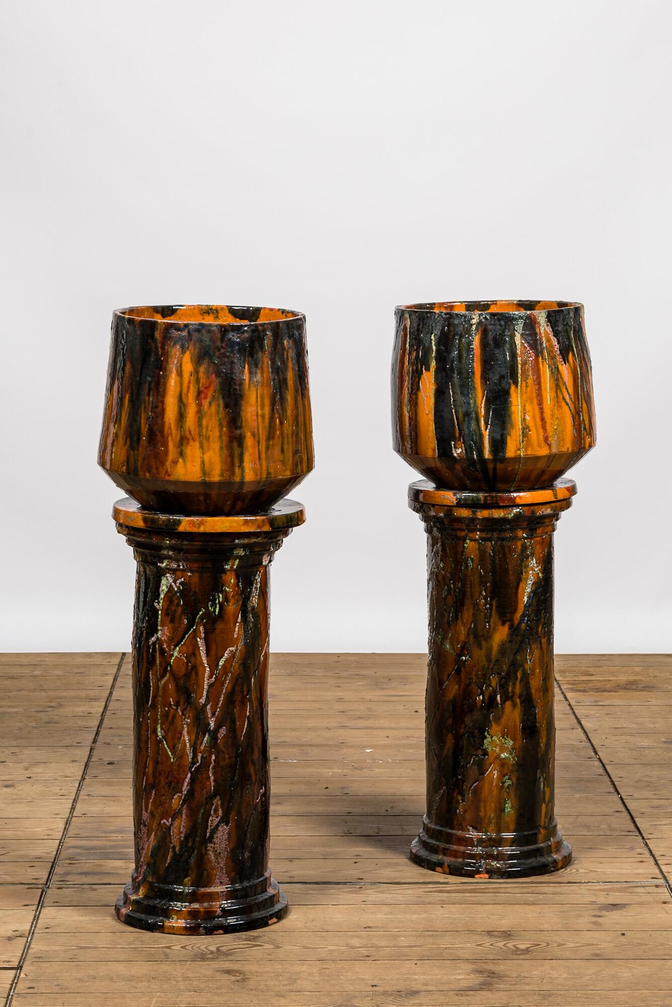 A pair of polychrome glazed terracotta jardiniÃ¨res on foot, 20th C. (1 of 3)