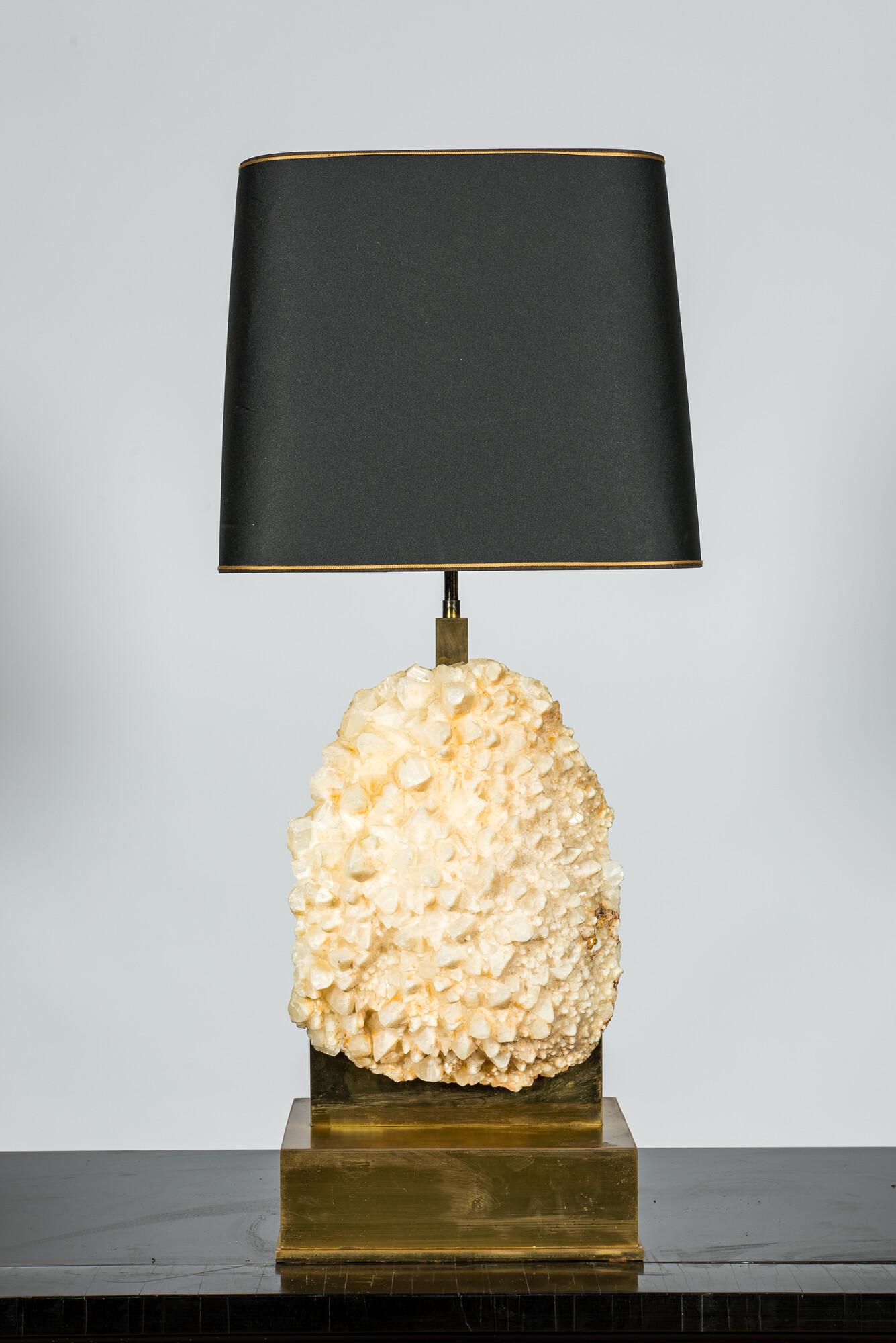 A brass table lamp mounted with a quartz rock, 2nd half 20th C.: Full title: A brass table lamp mounted with a quartz rock, 2nd half 20th C. Description: H 94 cm Similar lamps were produced by Ado Chale, Willy Daro and, to a lesser extent, Maison Charles. About thi