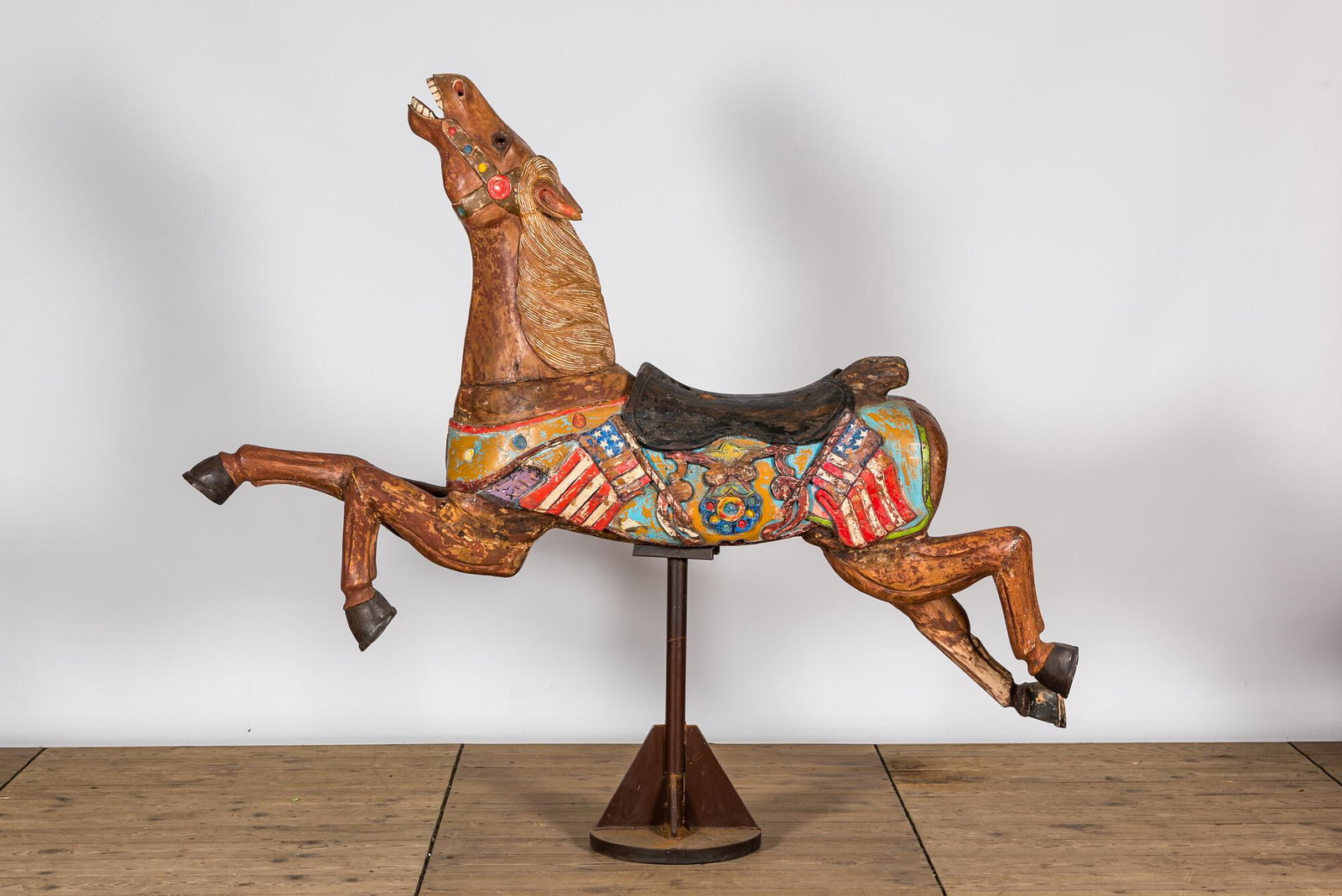 A polychrome wooden carousel horse, 20th C. (1 of 2)